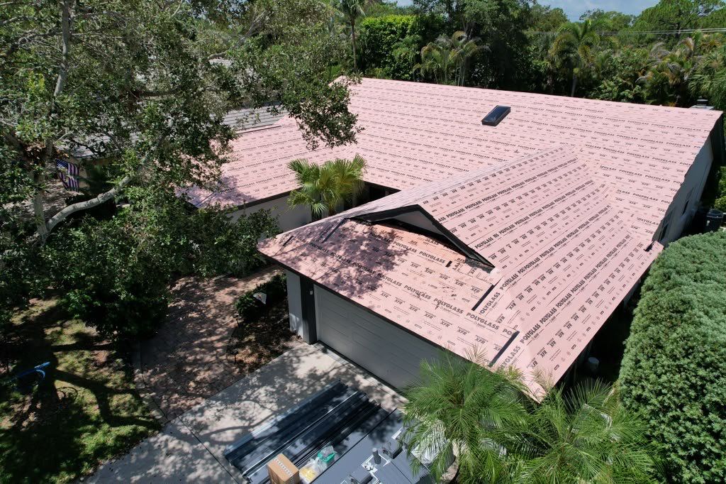 Standing Seam Metal Charcoal Grey Roof Replacement and Skylight Installation in Jupiter by Art's Roofing & Construction