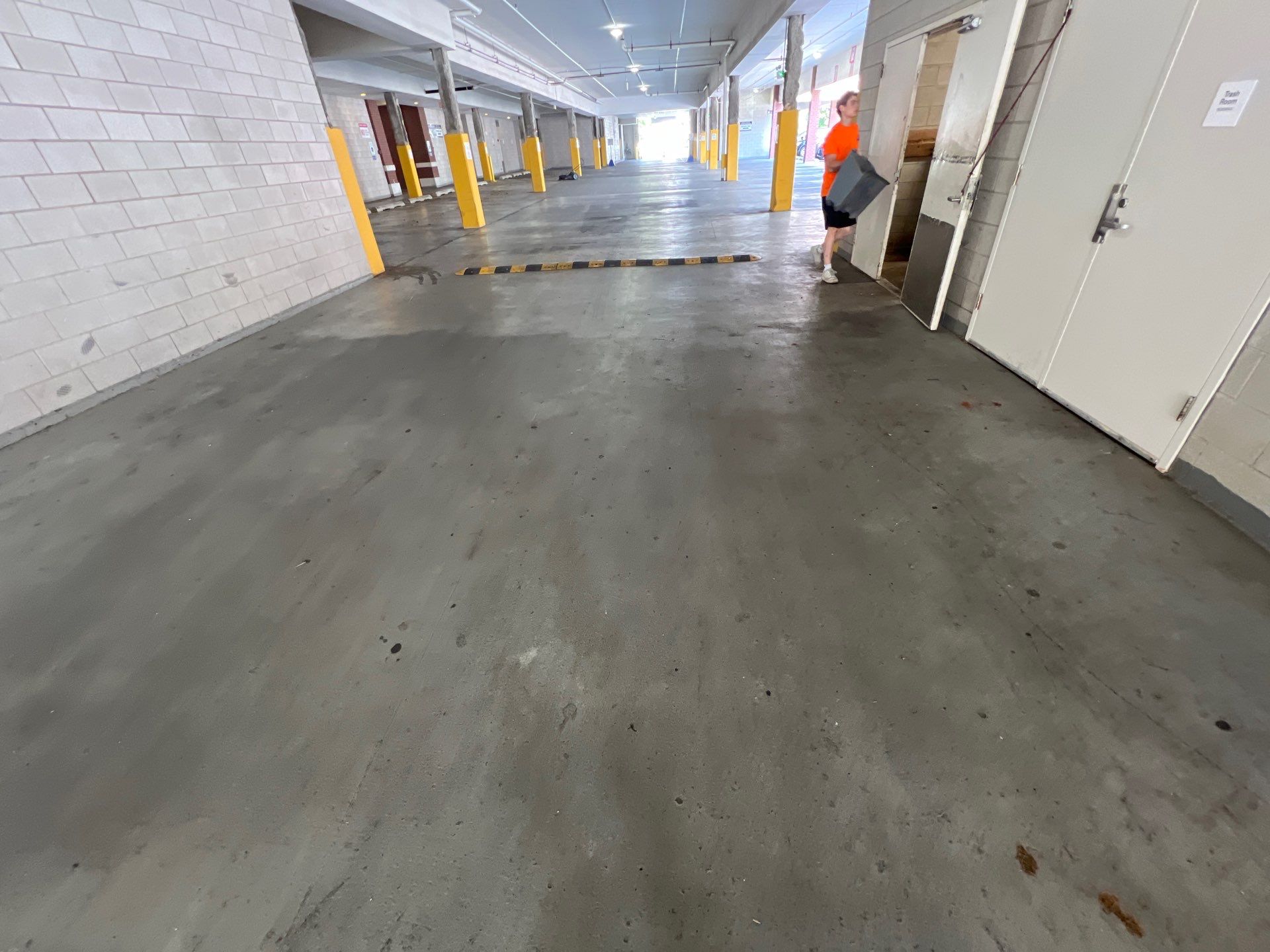 Parking garage using Hot water by Northern Power Washing LLC.