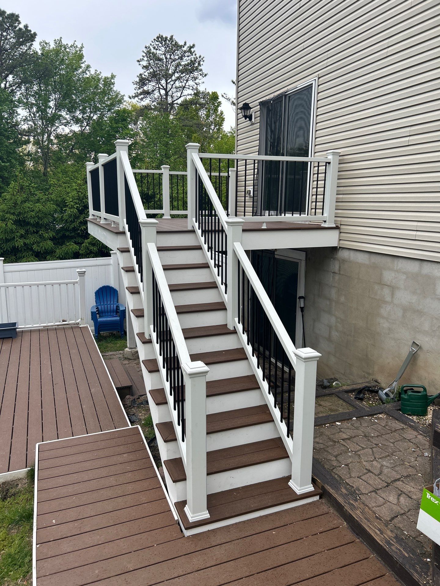 Elevated Composite Deck Replacement with White Railing in Tannersville by Herts Roofing & Construction