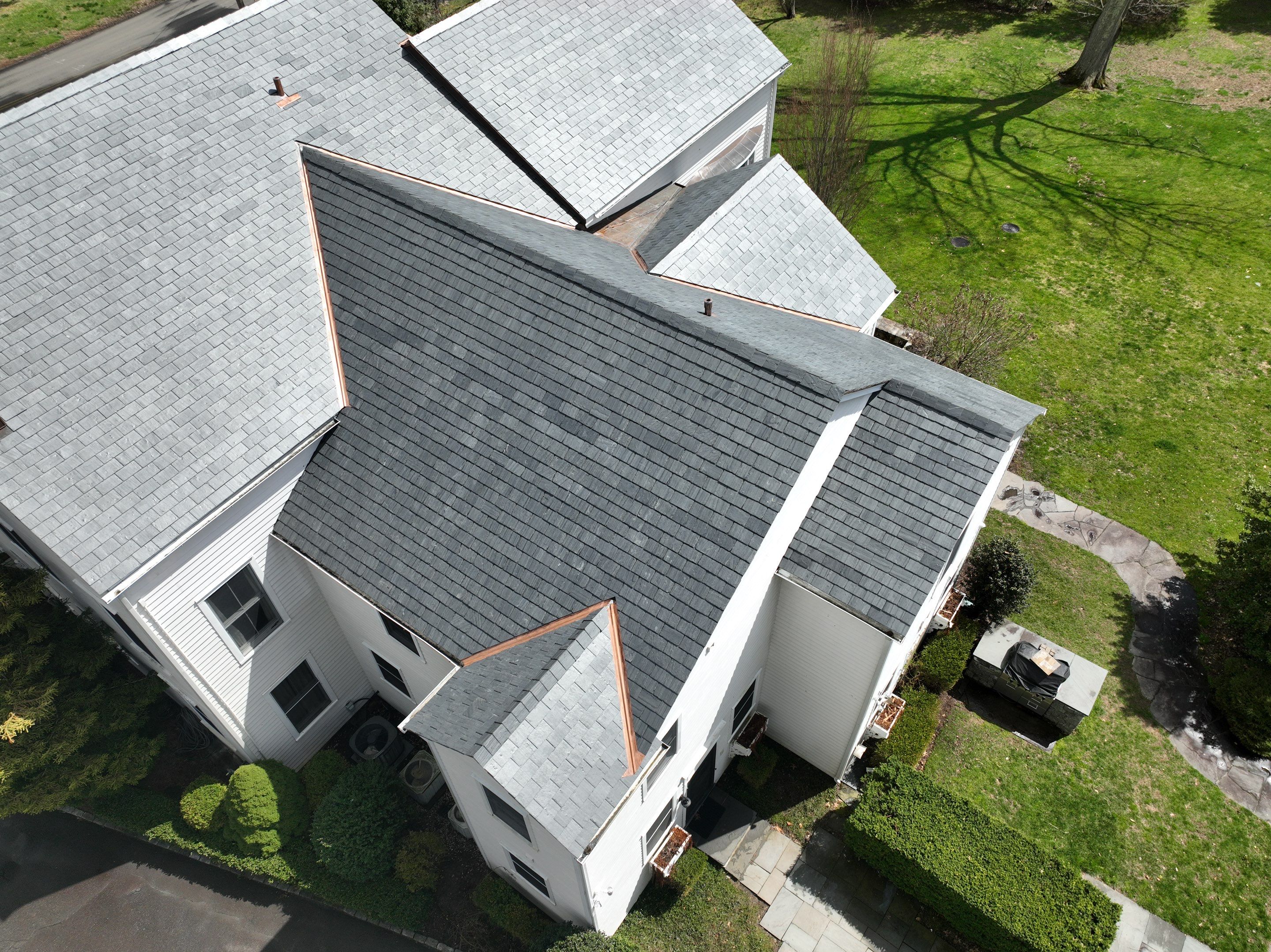 Residential Roofing Installation using Vermont Slate by A Plus Exterior