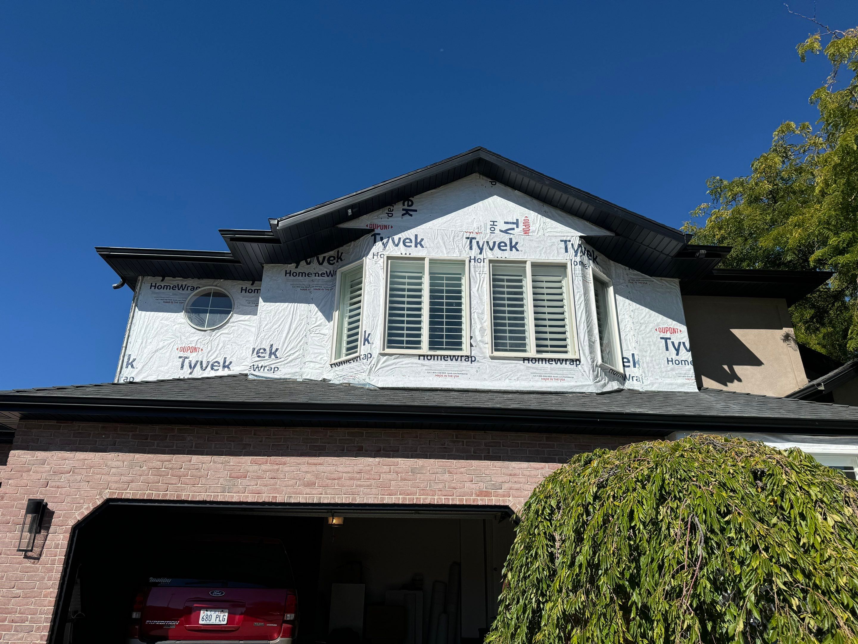 Centerville | High-End Stucco Conversion Accent | Walnut Cedar & Primed B&B by Ideal Siding Utah