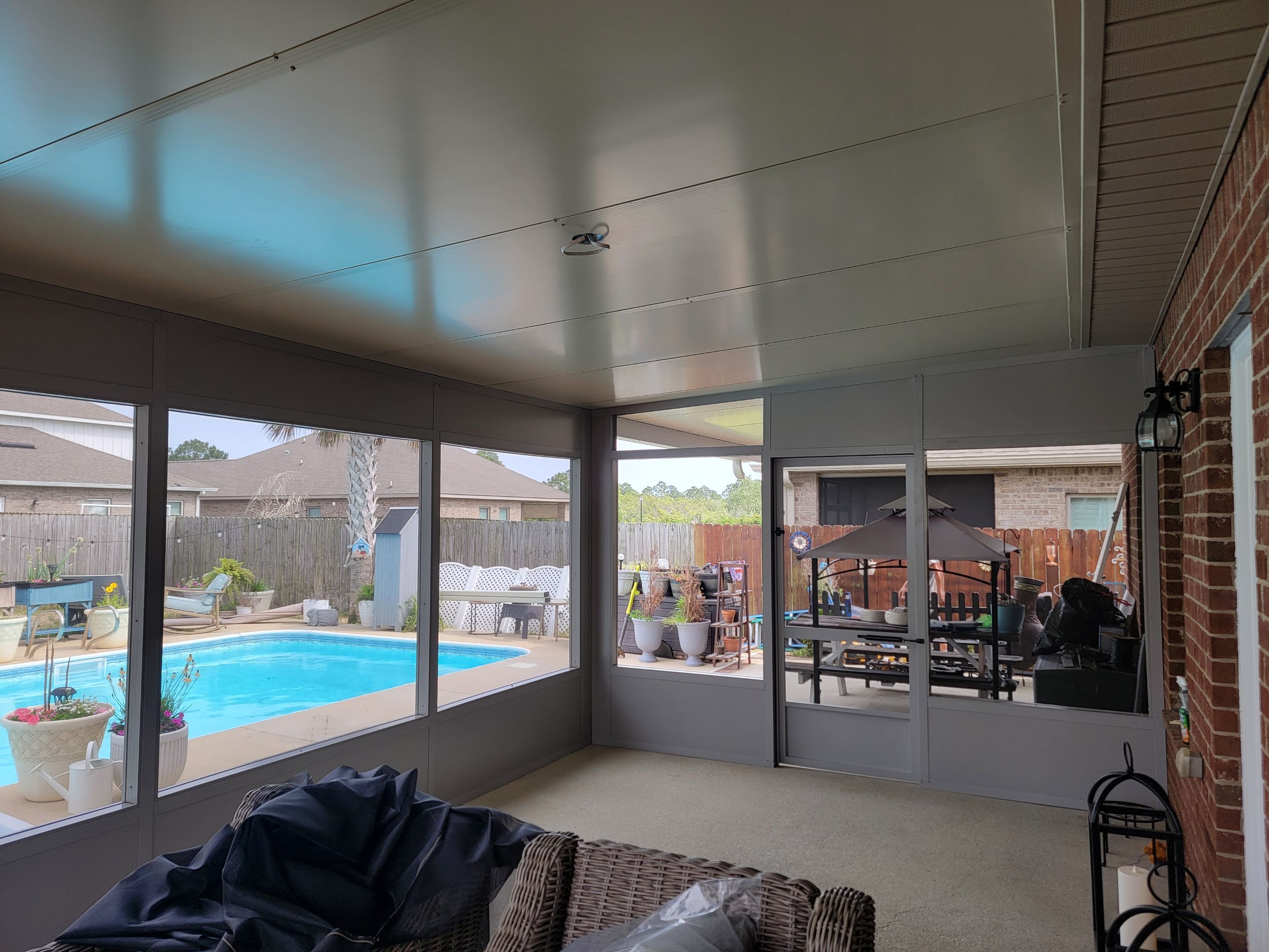 Poolside Screen Room & Patio Cover in Gulf Breeze by Titan Sunrooms