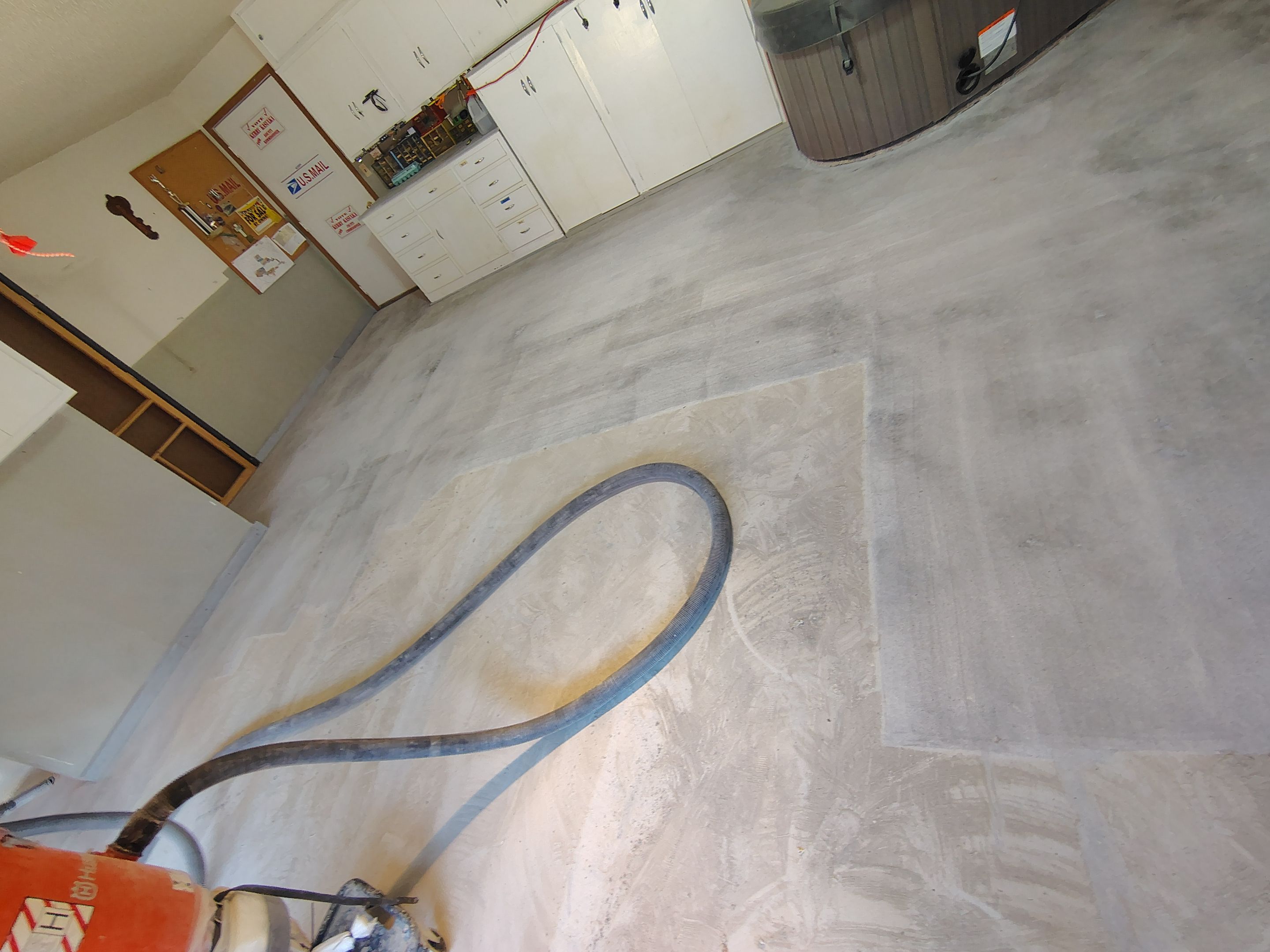 Domino Flake Garage Floor Coating Installation in Sioux Falls by Select Painting, Coatings & Garage Cabinets
