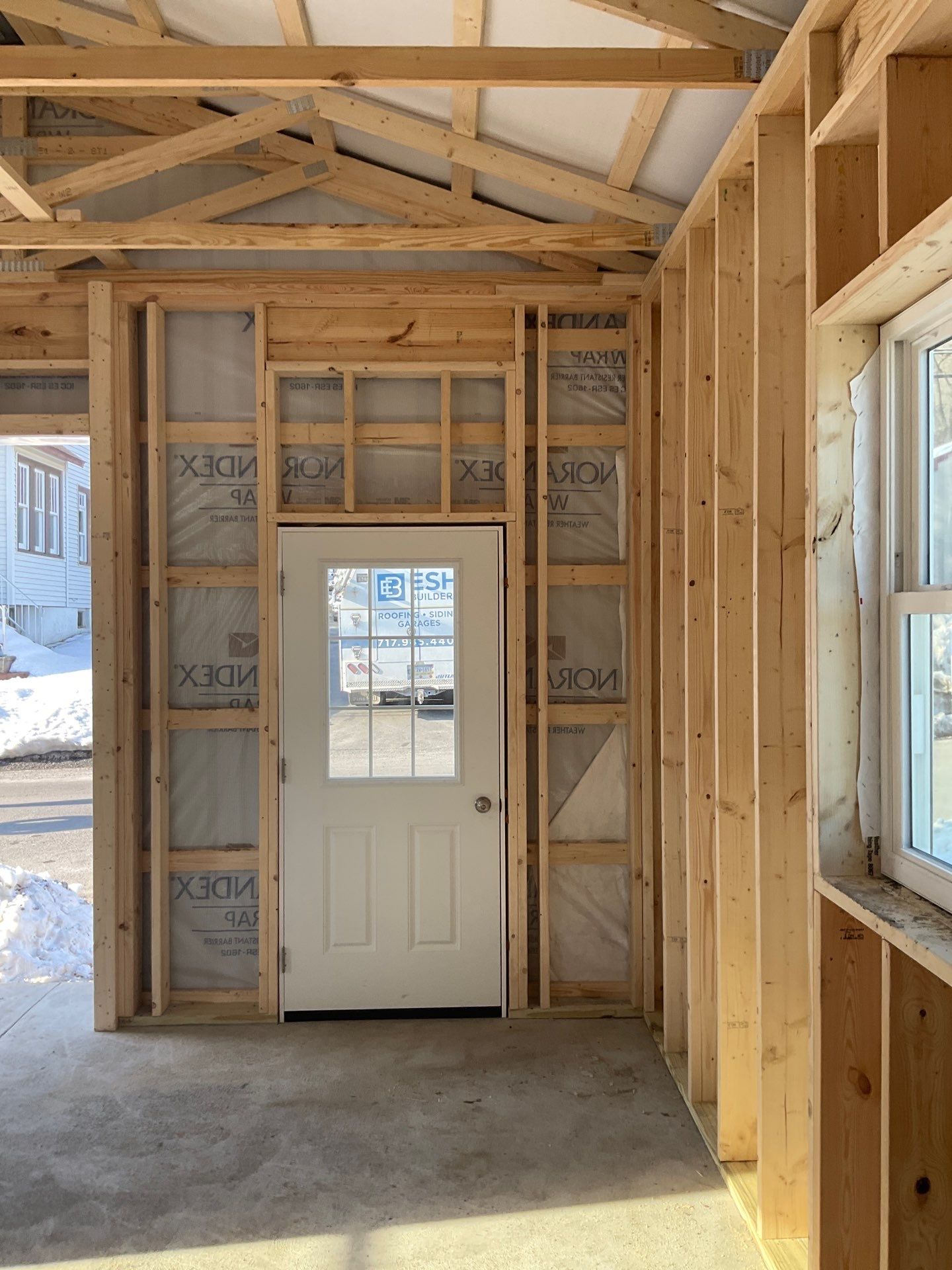 New Red Metal Garage Construction and Residential Window Replacement in Ashland by Esh Builders