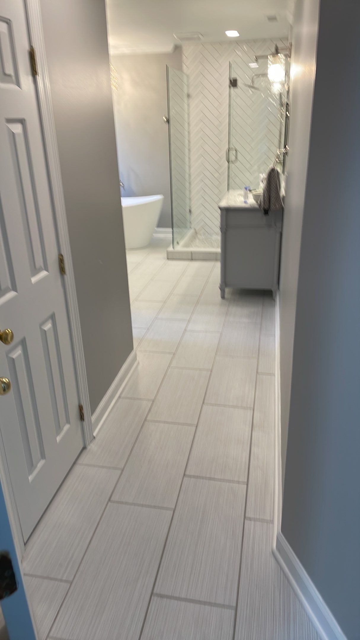 Bathroom Remodel using Schluter by Footprints Floors of Coastal Carolina