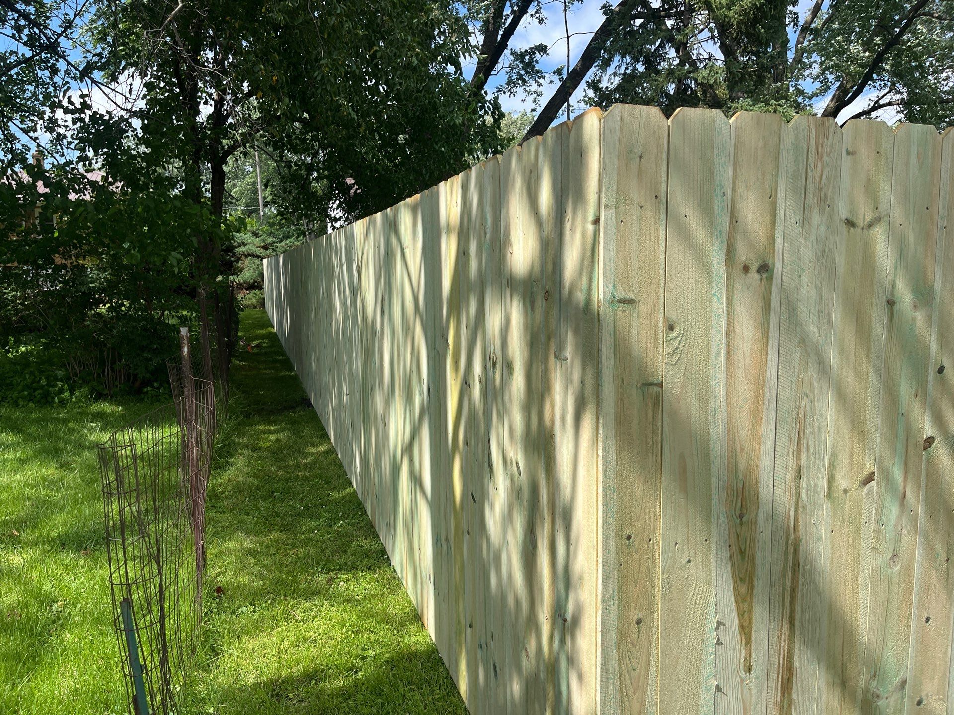 Custom Treated Pine Privacy Fence and Chain Link Installation in Cedar Falls by Perfect Picket Fence and Stain