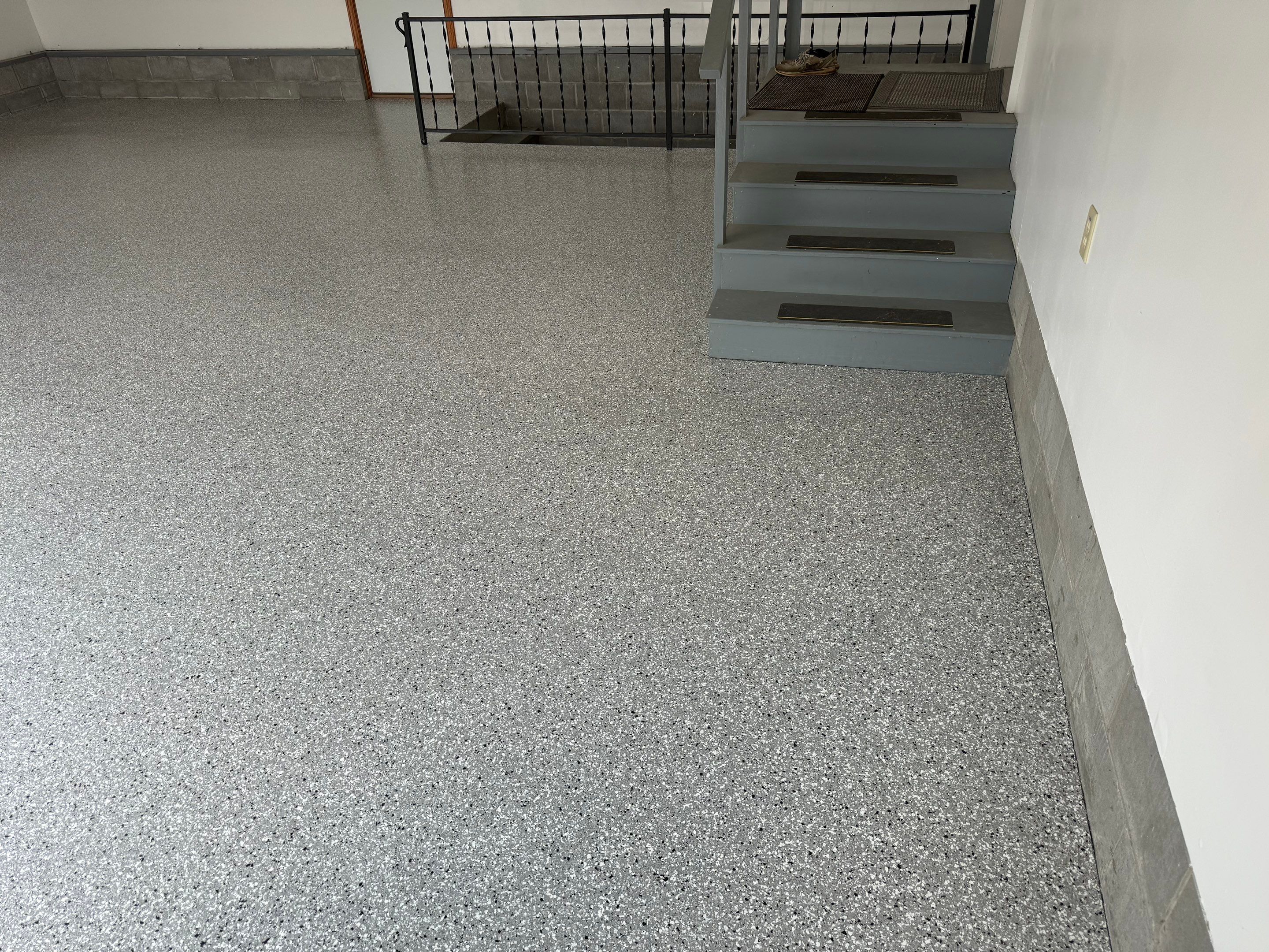 Feather Grey Garage Floor Coating and Concrete Restoration in Mitchell by Select Painting, Coatings & Garage Cabinets