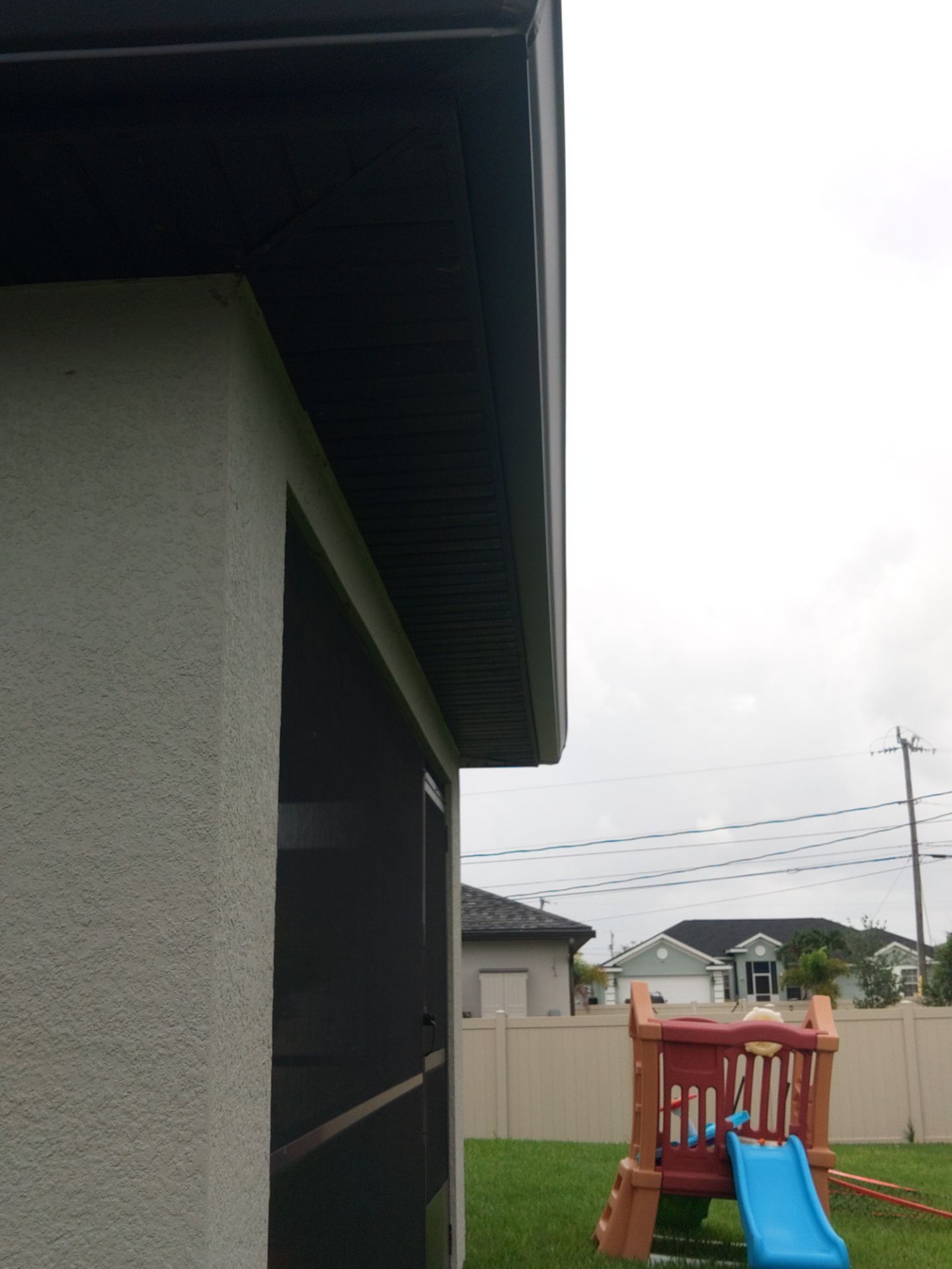 Black Seamless Gutters using black seamless gutters in Cape Coral FL by Gutter Professors