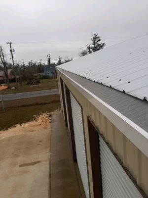 Gutter Installation Using White Seamless Gutters and Gutter Guards
