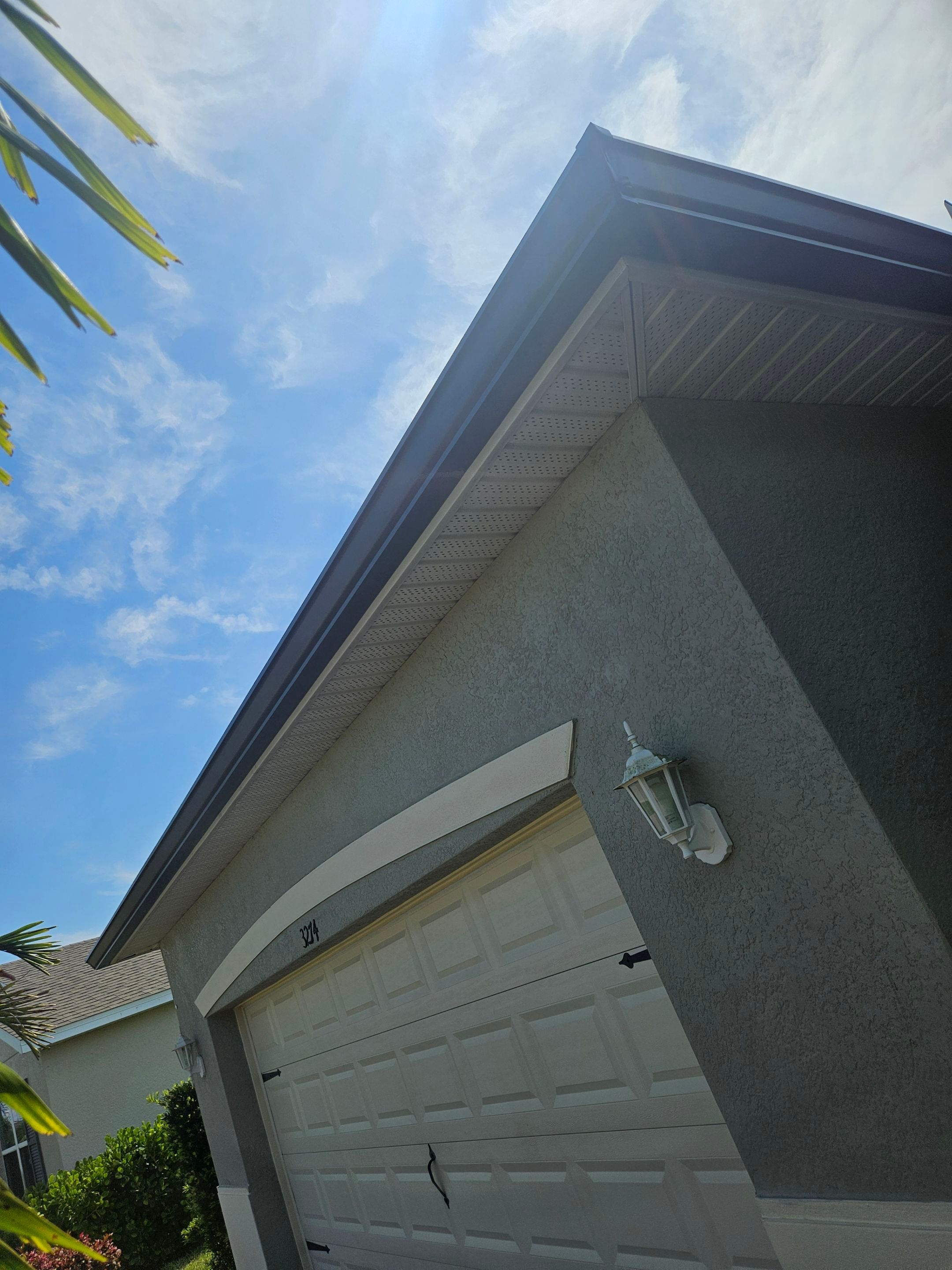 6-inch Seamless Aluminum Gutter Installation using Bronze gutters and Downspouts in Cape Coral FL by Gutter Professors