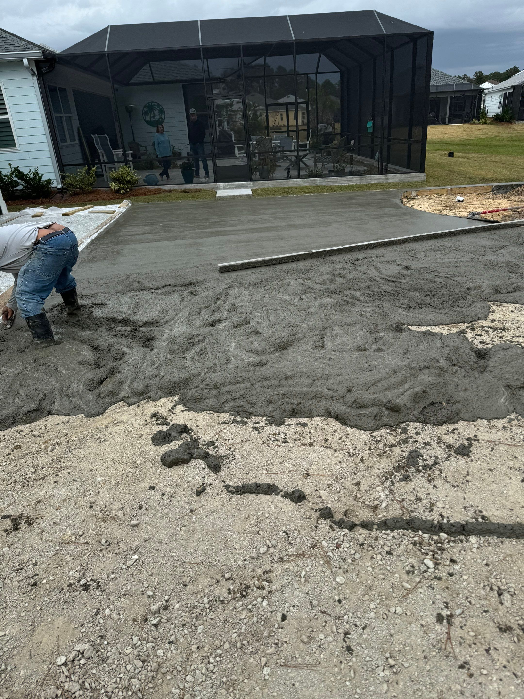 Hardeeville Screened-In Concrete Patio and Integrated Artificial Turf by Lowcountry Scapes, LLC