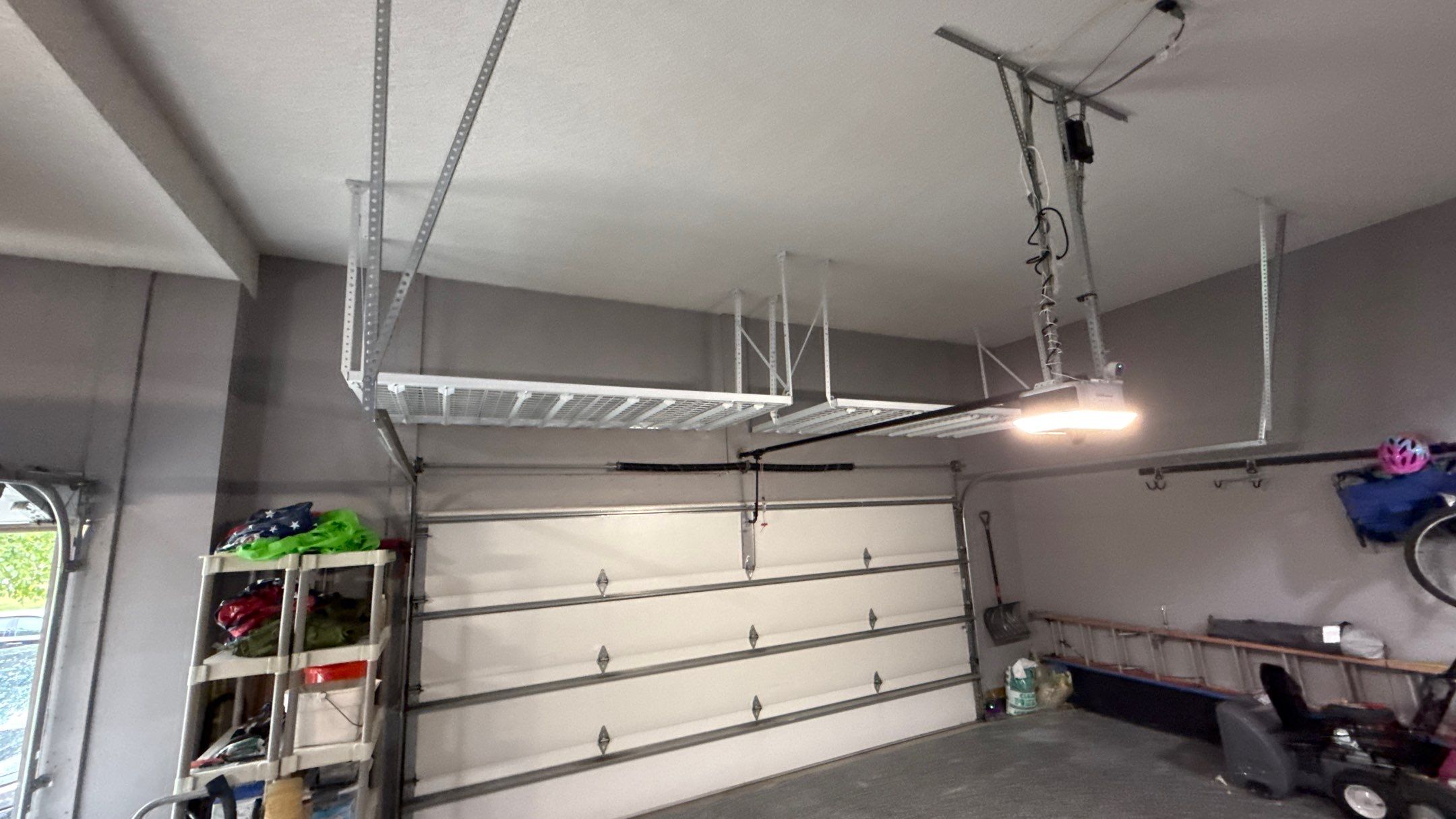 Ceiling Mounted Overhead Storage Rack Installation in Shawnee by Banner Garage