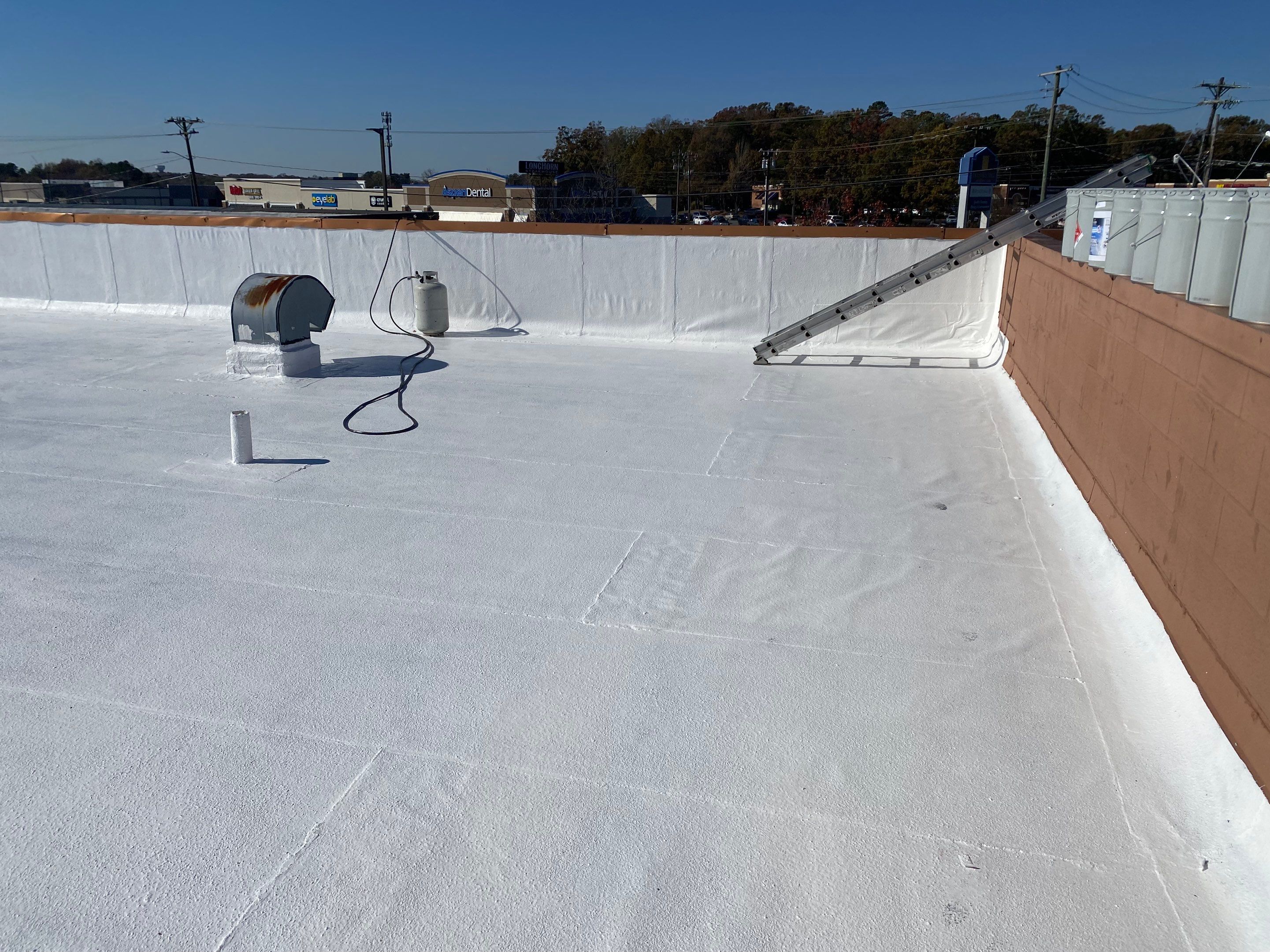 Commercial Coating using Poly Urerthane and Silicone Coating by Just In Time Roofing and Restoration