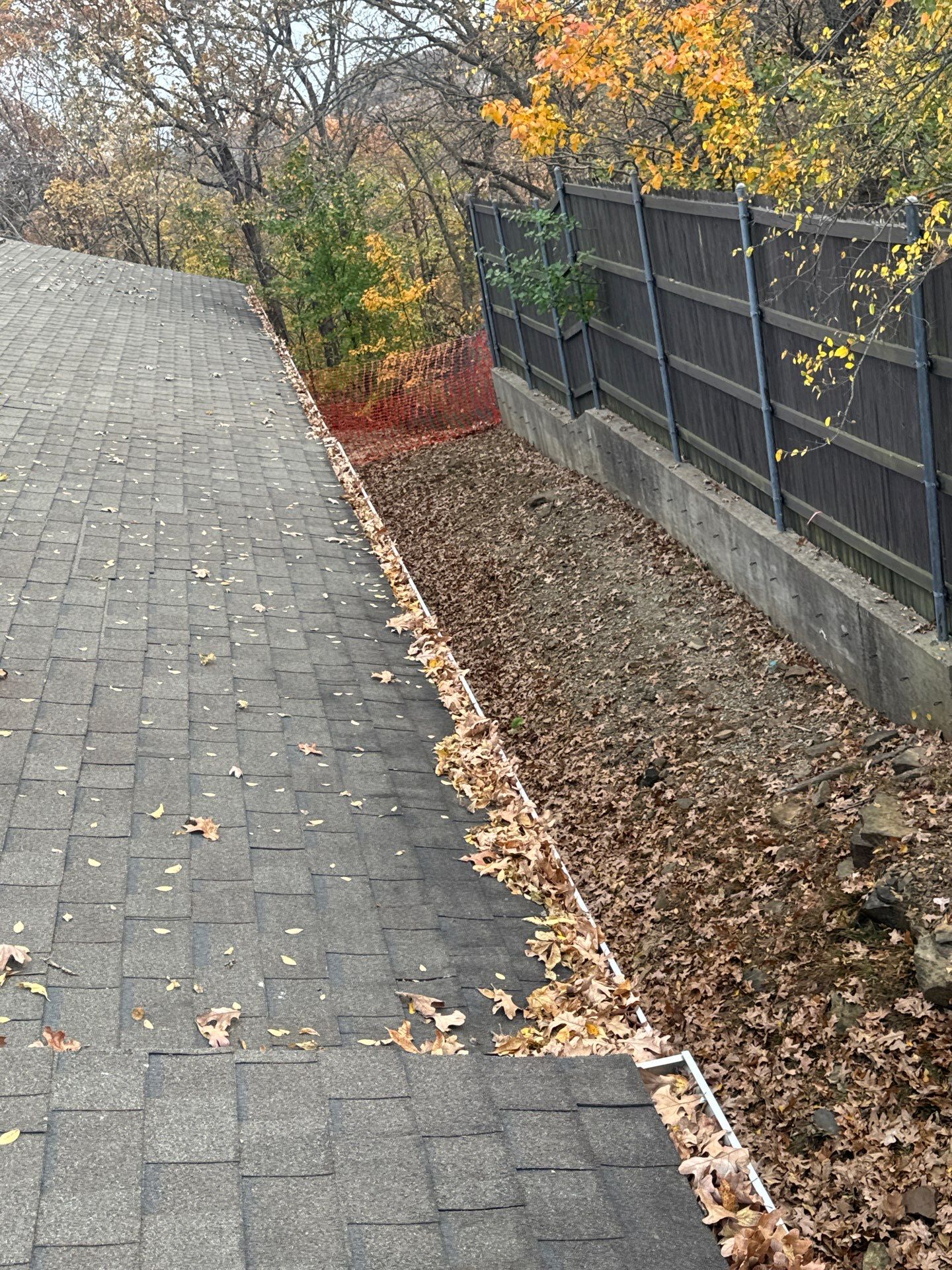 Commercial gutter cleaning Tulsa before photo with filled gutters