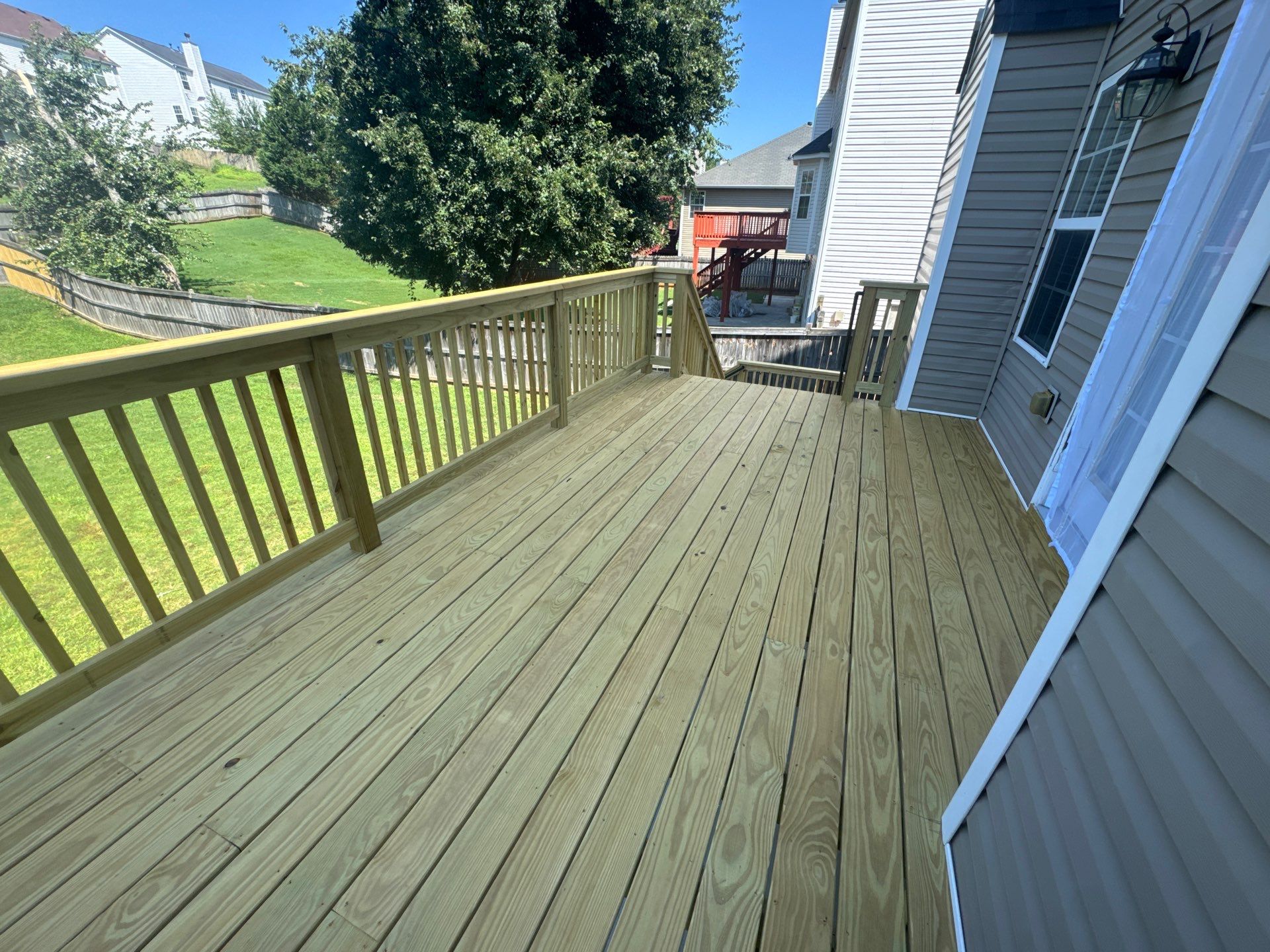 Backyard Deck Expansion & Custom Staircase Installation in Suwanee. by Swift Home Renovations
