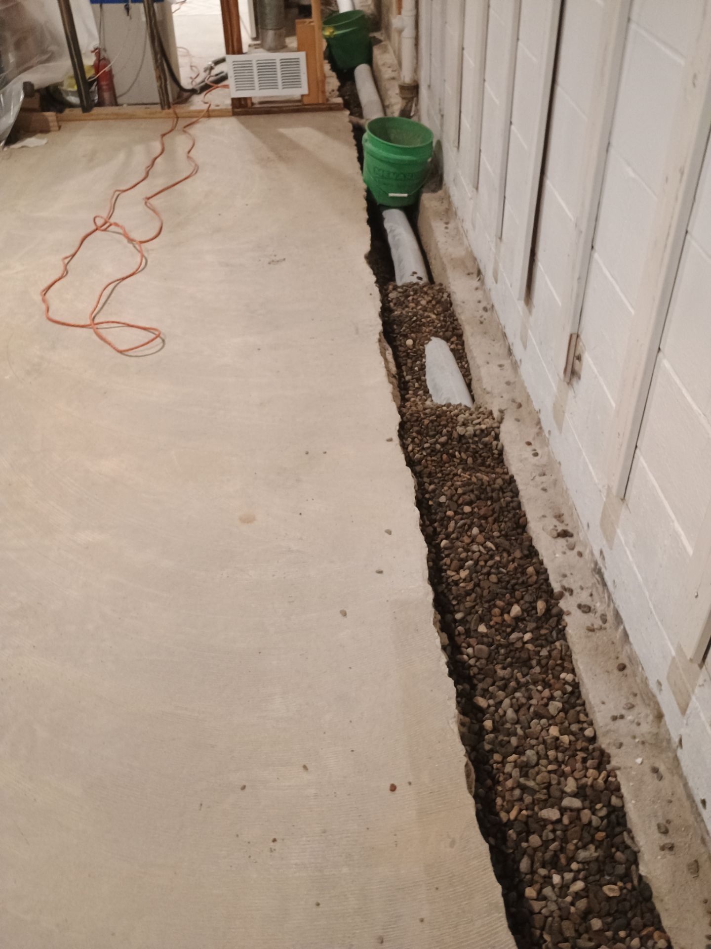 Interior Drain Tile & Buried Discharge in St. Anthony, MN by Waterproofing Northeast