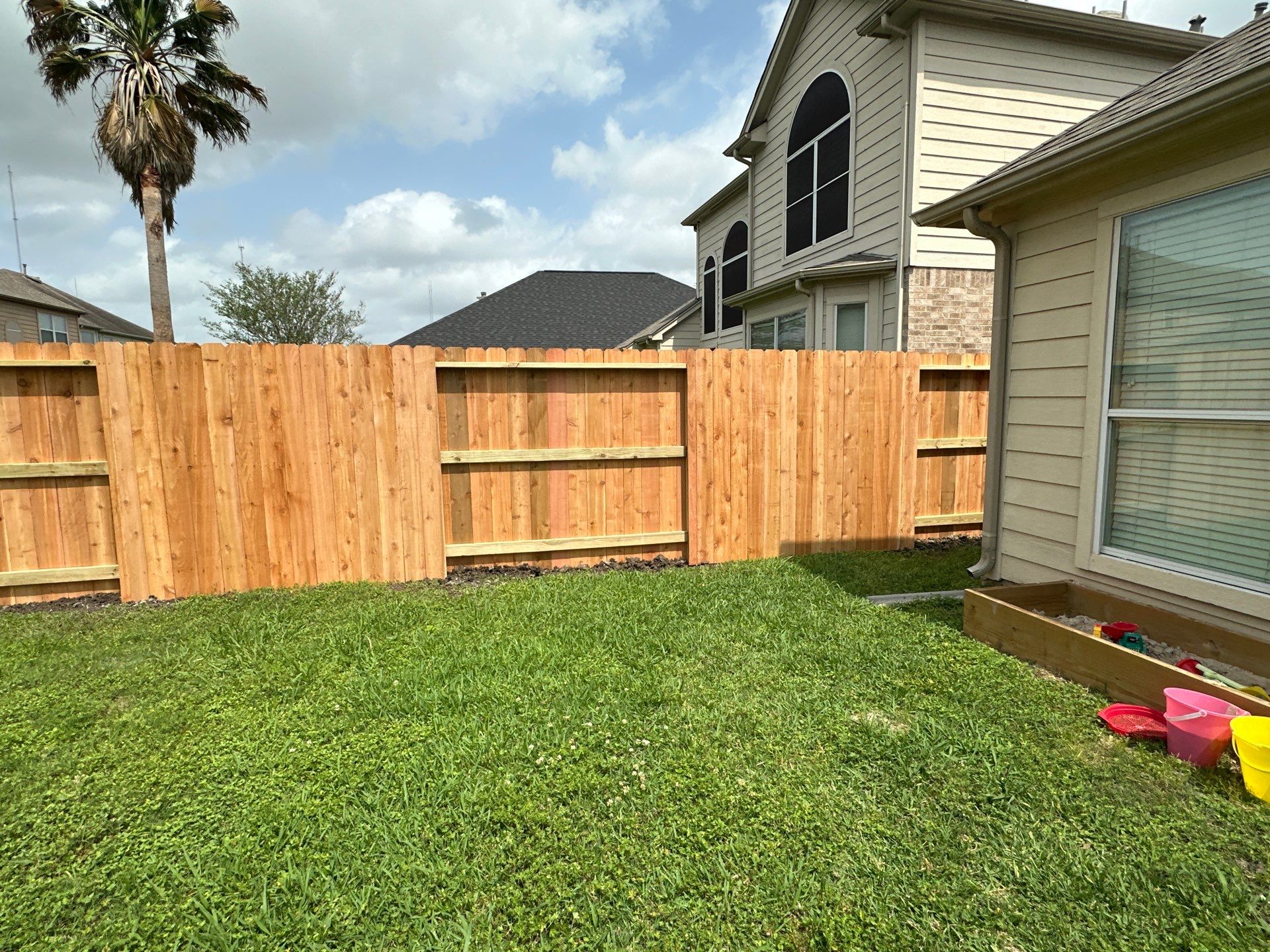 Wood fence with alternating panels by Tim's Fences