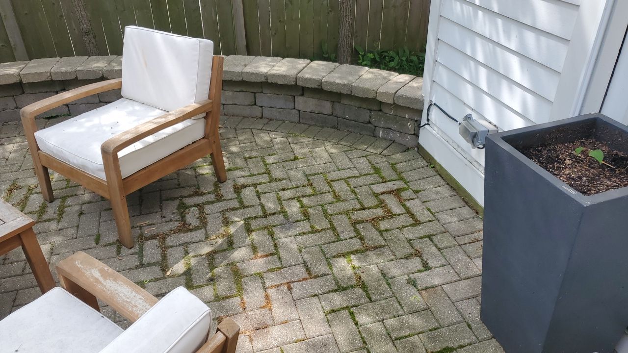 Brick patio repair, clean sand and seal by Northern Power Washing LLC.