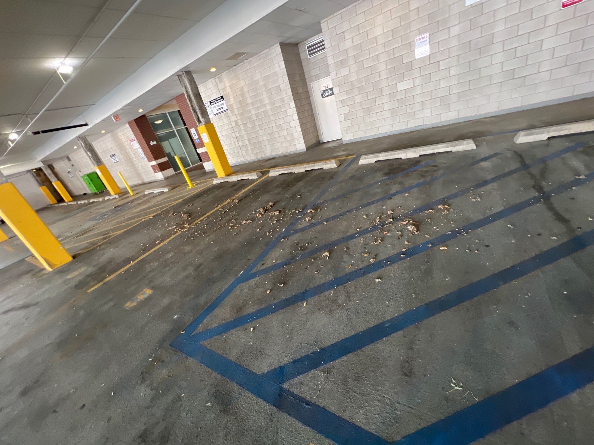 Parking garage using Hot water by Northern Power Washing LLC.