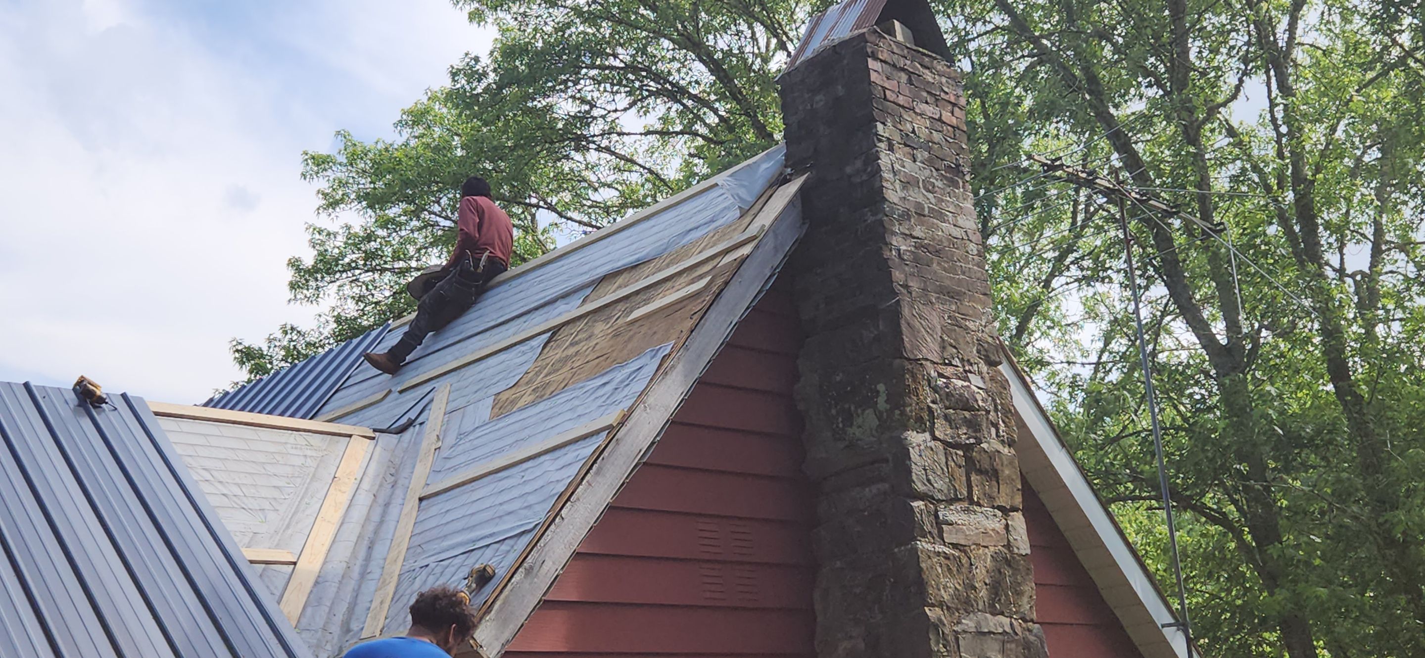 Residential Roofing Installation using 26 Gauge Colored Panels by Hostetler Roofing