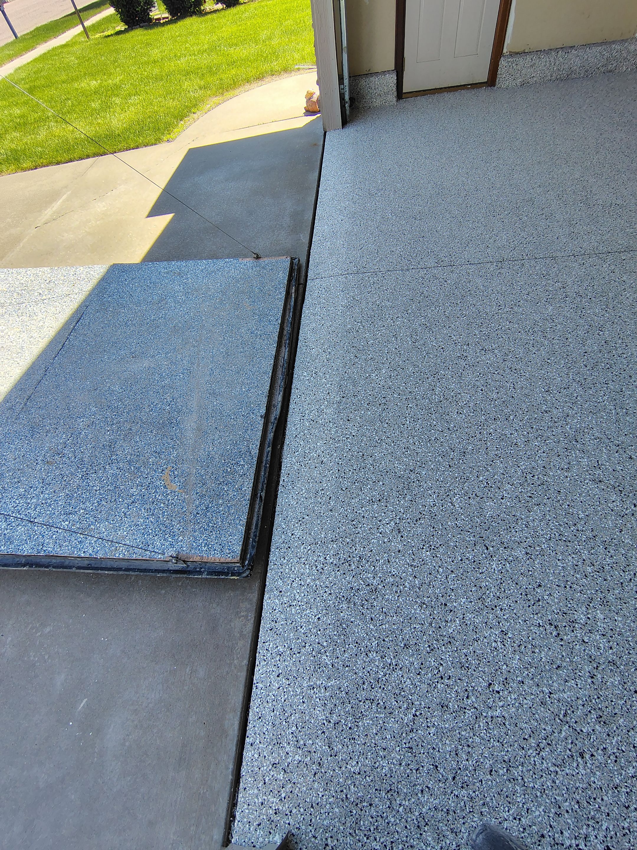 Multi-Car Garage Concrete Coating and Epoxy Finish in Sioux Falls by Select Painting, Coatings & Garage Cabinets
