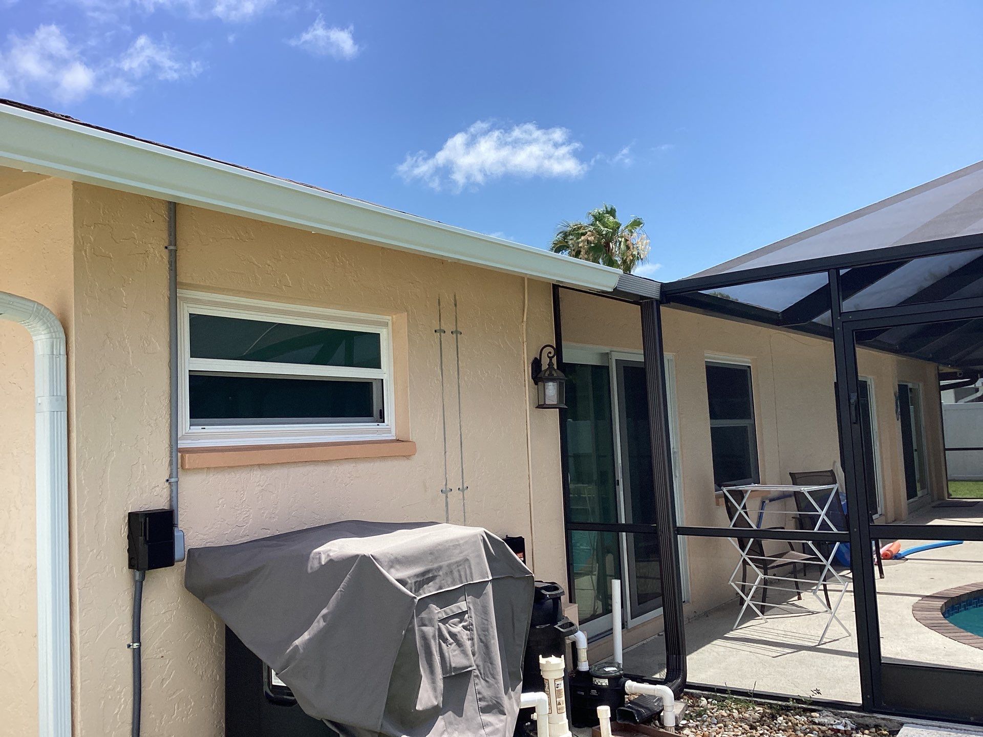 White K Style Seamless Gutters using 3X4 Elbow Downspout in Cape Coral FL by Gutter Professors