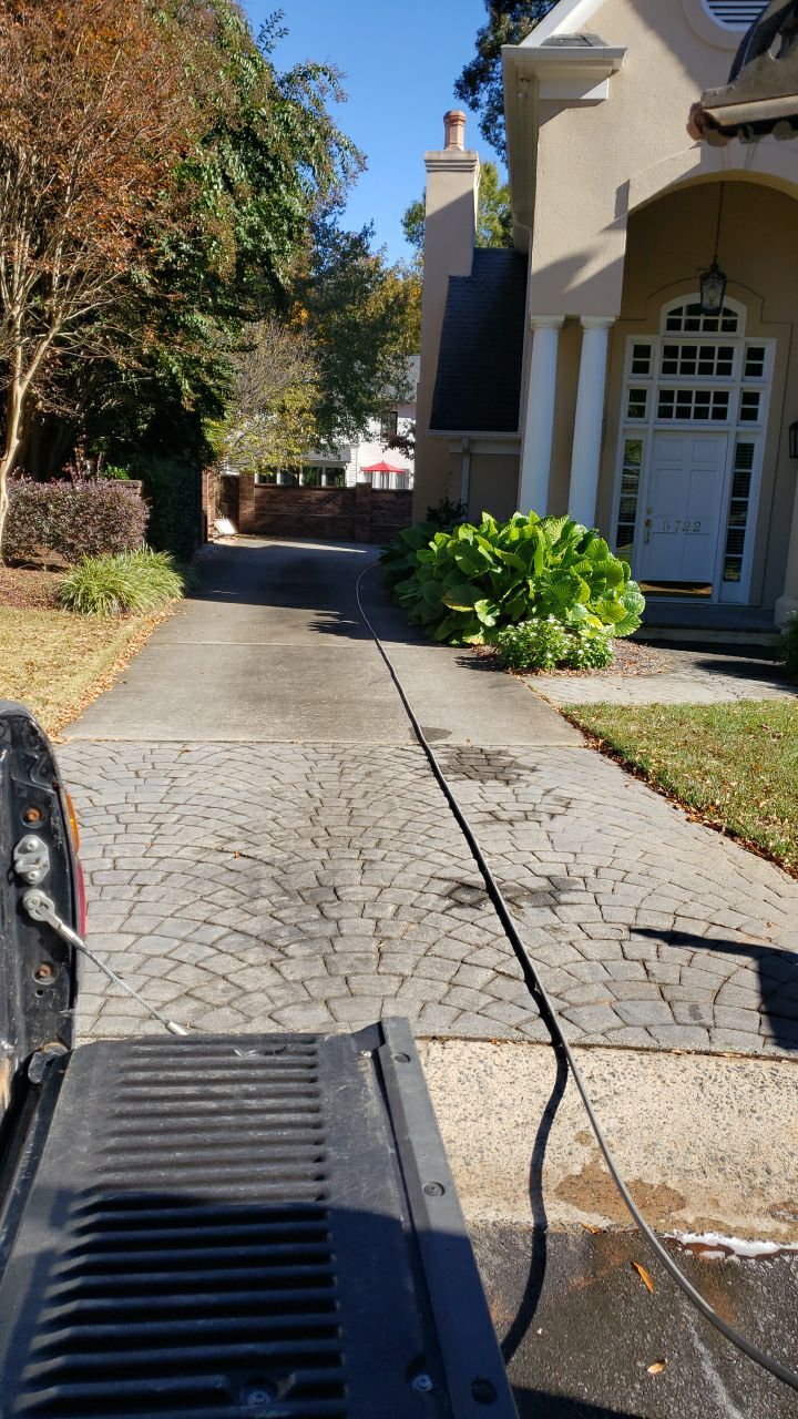 Driveway Clean using cleaner by Power Wash Masters LLC