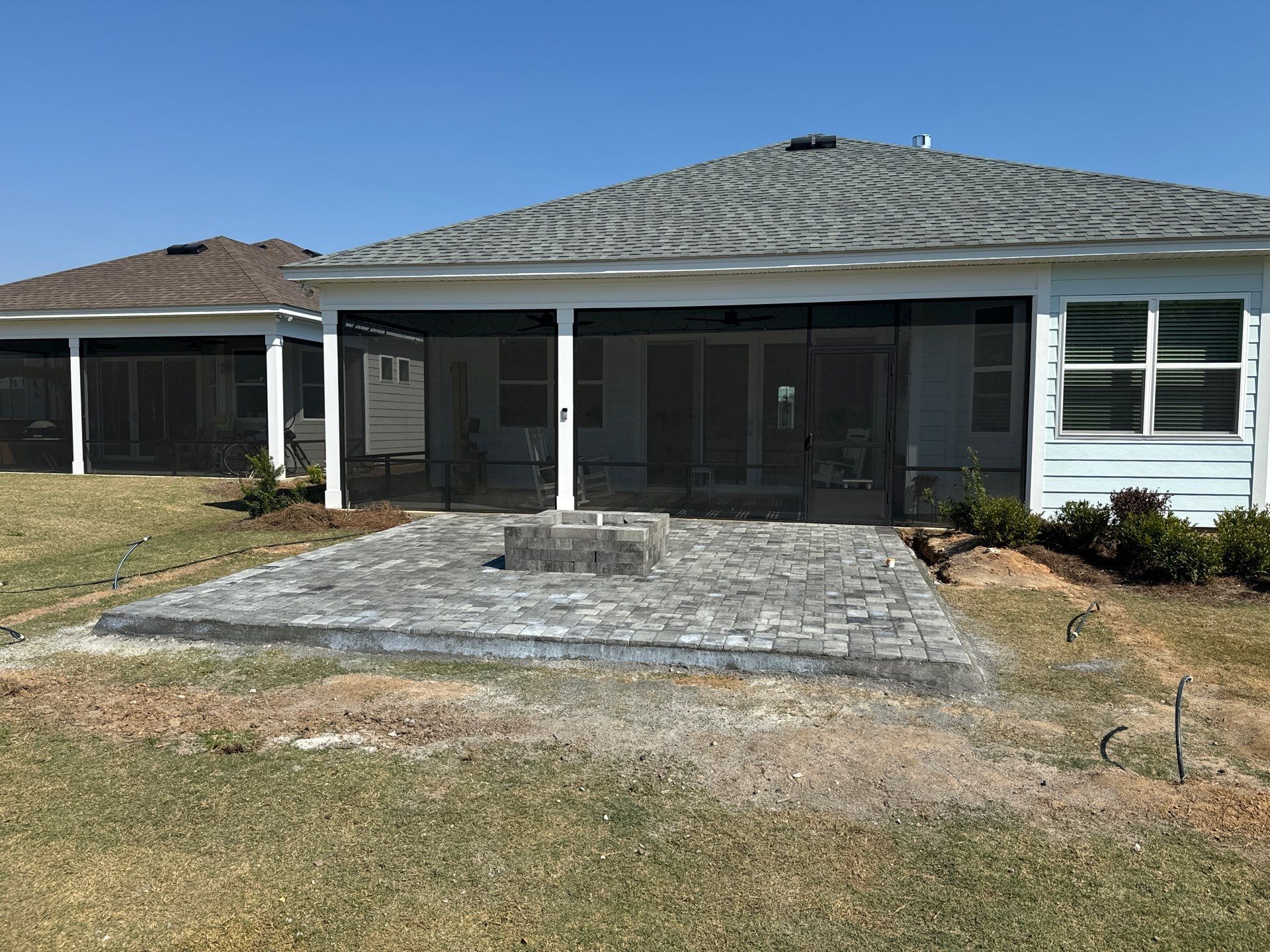 Custom Grey Paver Patio and Square Fire Pit in Hardeeville by Lowcountry Scapes, LLC