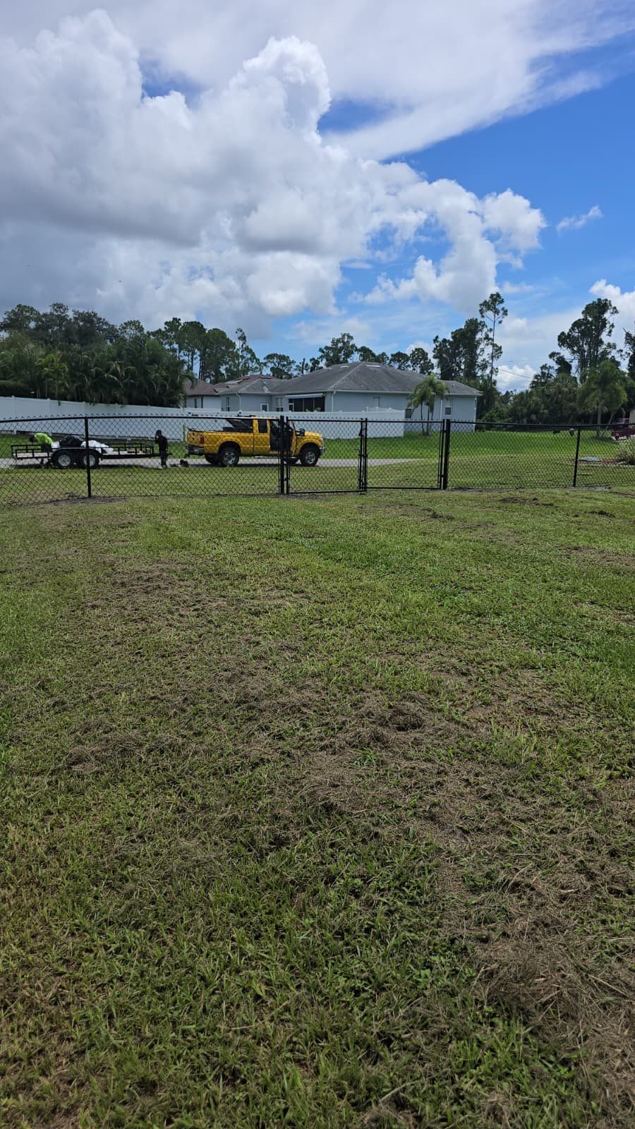 Black Chain Link Perimeter Fencing for North Port Residential Property by True Fence LLC