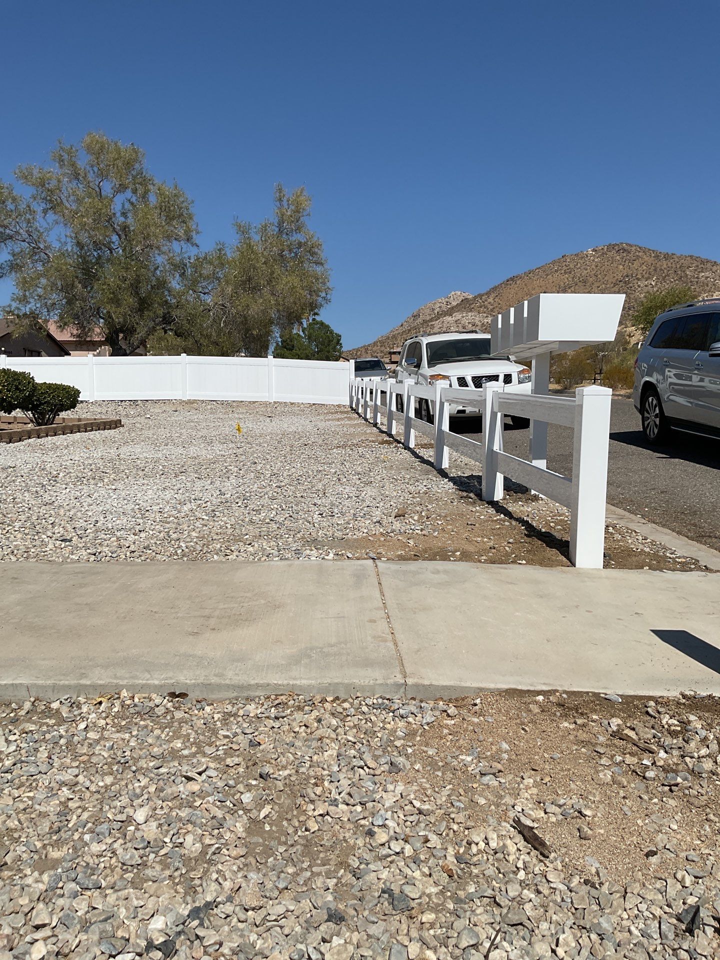 4' and 6' Privacy Vinyl with 2-Rail Ranch Style Vinyl Fence by Fence Guys Inc.
