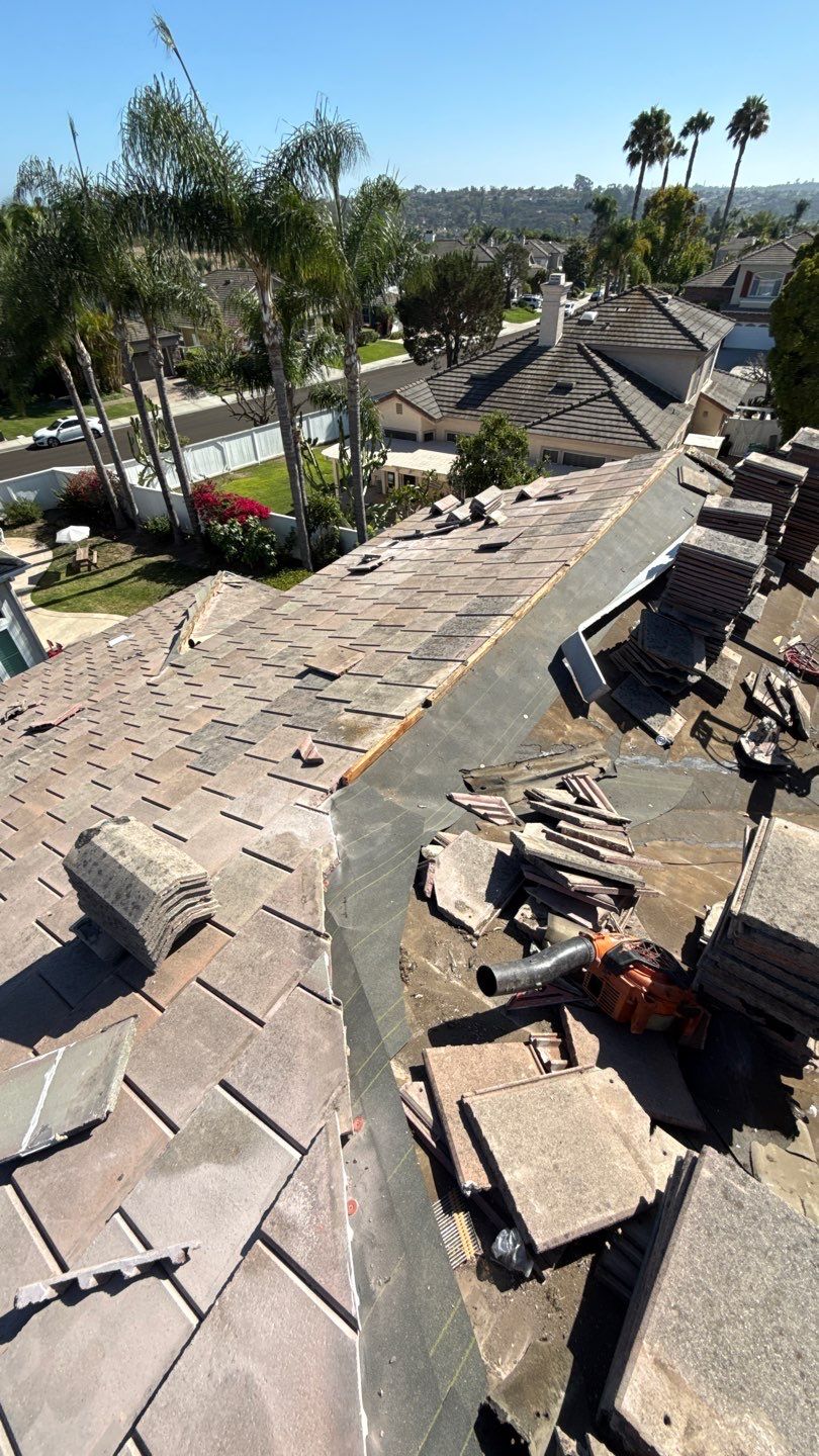 Carlsbad Concrete Tile Roof Replacement with Copper Flashing and Skylights by Reliable Roofing San Diego Inc.