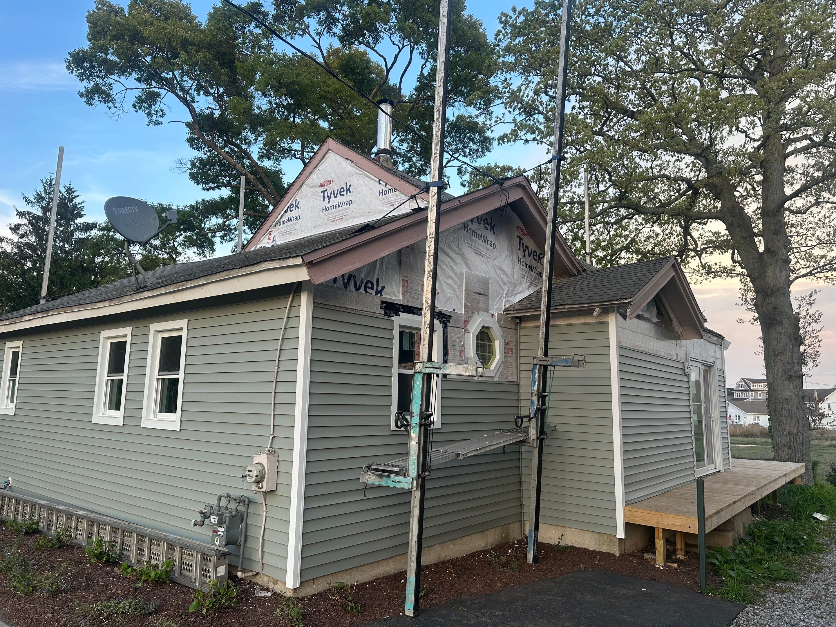 Milford Exterior Renovation Featuring Custom Siding and Wood Deck Installation by A Plus Exterior