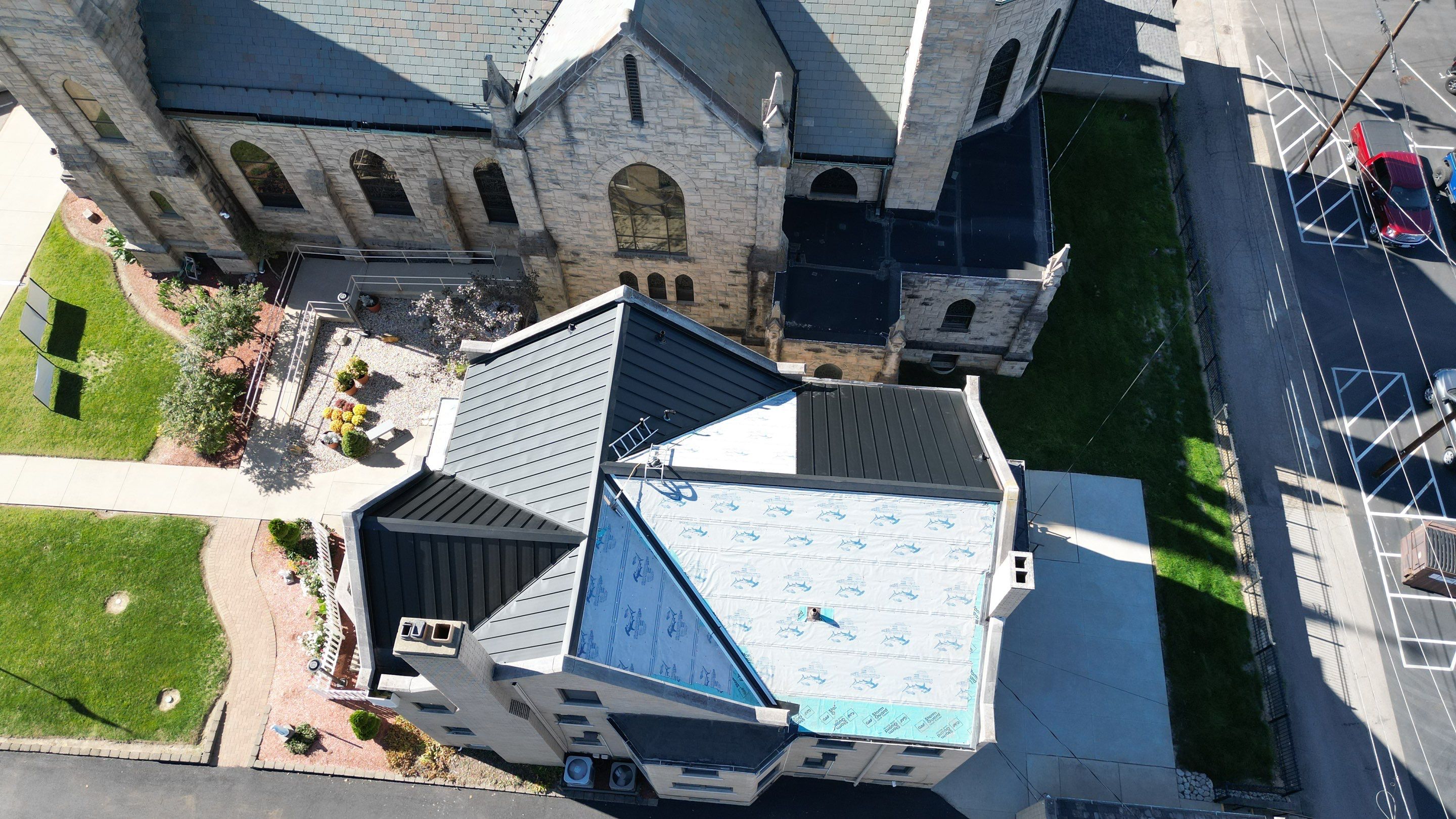 Commercial Roofing Installation using Standing Seam Metal - Frost Black by RoofX 