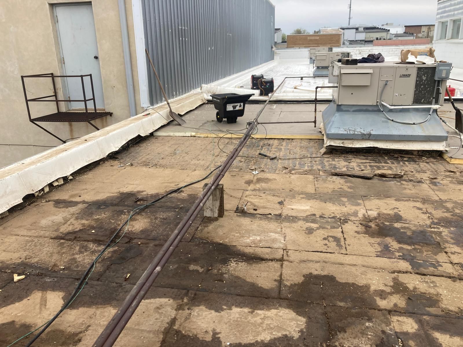 Full Roof Tear-off with new Code ISO insulation and 50 Mil Membrane by Grell Roofing, LLC