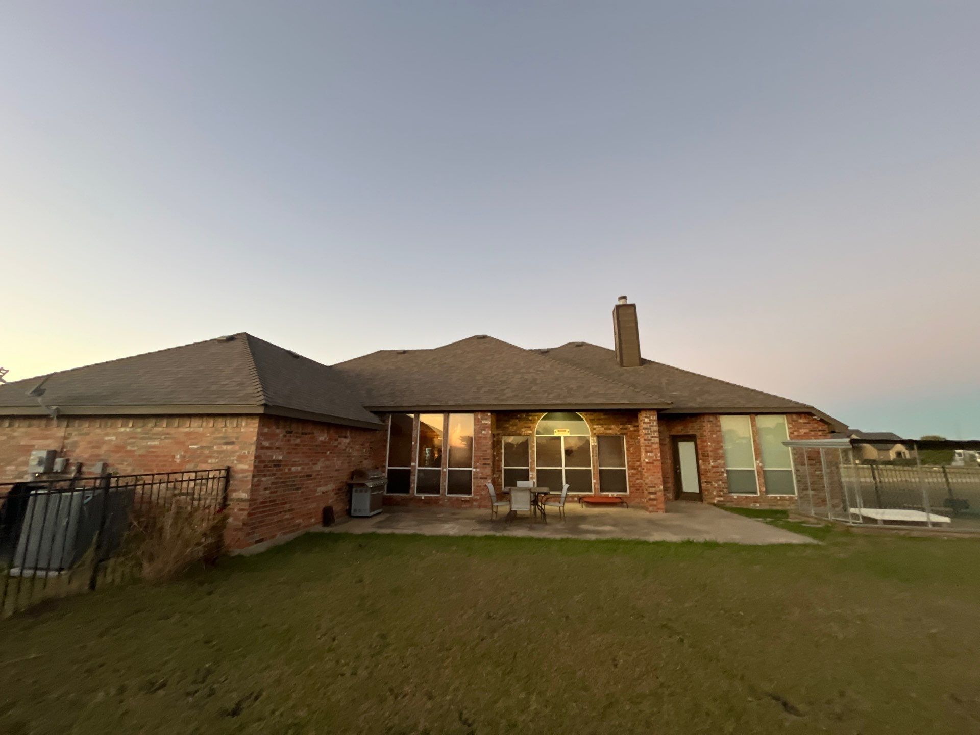 Brick with Malarkey Natural Wood by Tejas Roofworks + Restoration