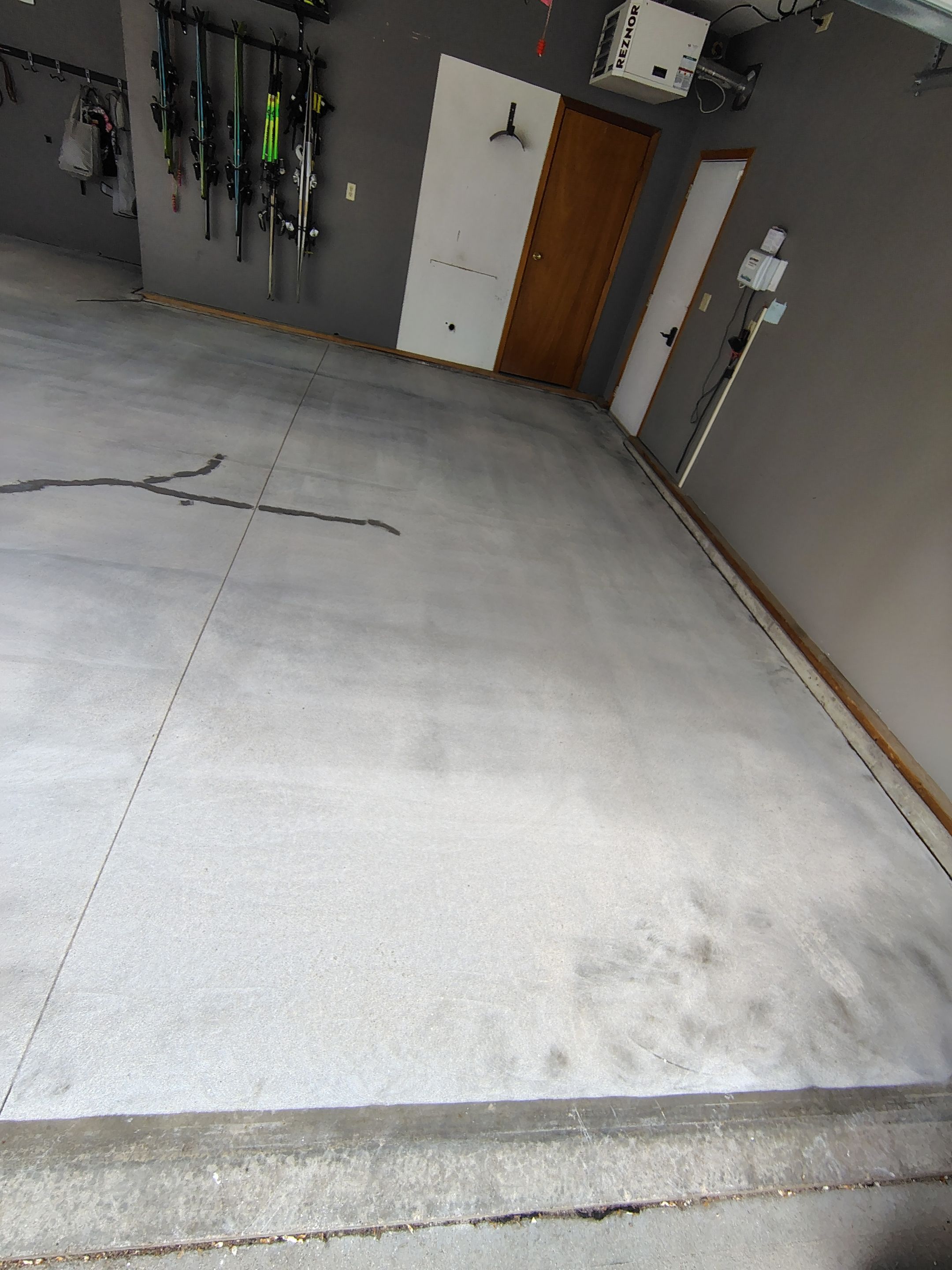 Garage Floor Concrete Coating and Crack Repair in Sioux Falls by Select Painting, Coatings & Garage Cabinets