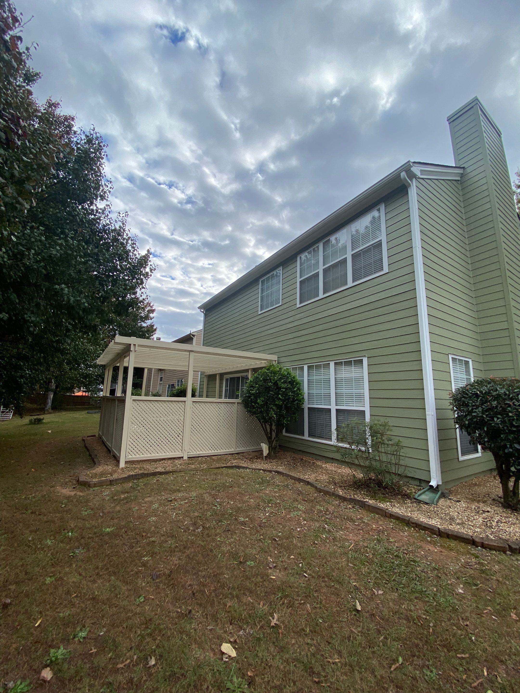 Exterior Painting for a Two-Story Sage Green Home in Kennesaw by Swift Home Renovations