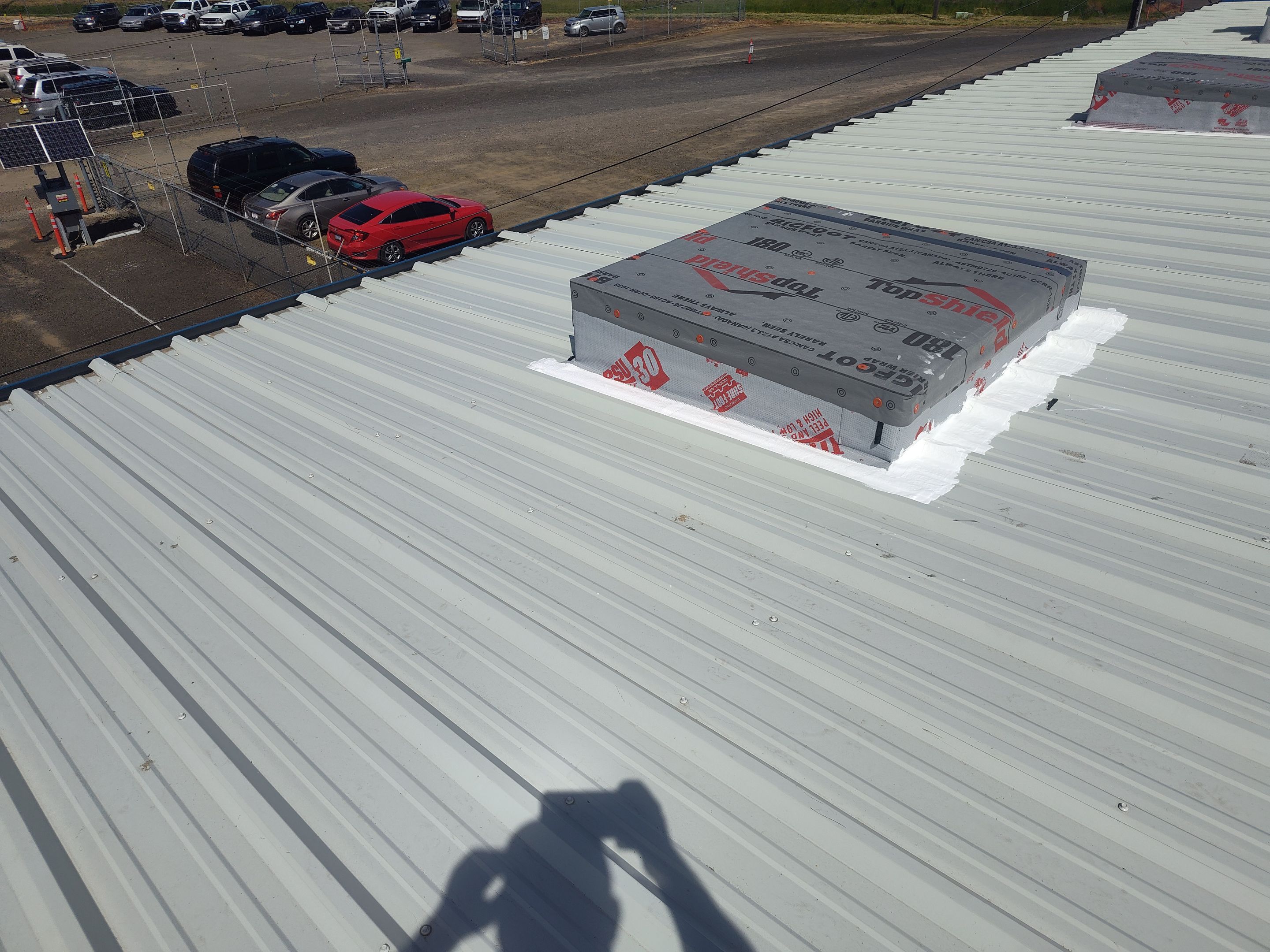 Installing New Curbs on a Metal Roof for new equipment by BEST Roofing & Waterproofing