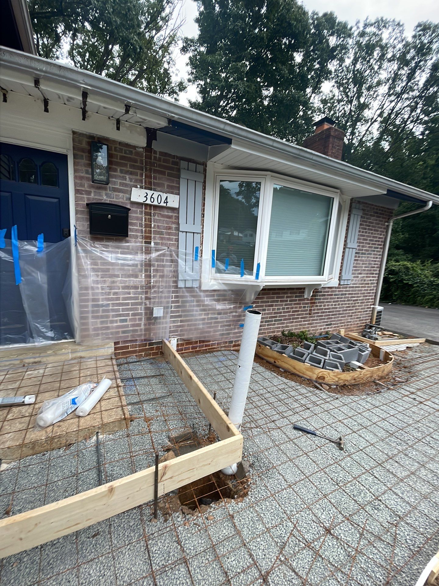New walkway with stairs and a new front porch by Fairfax Contractors, LLC