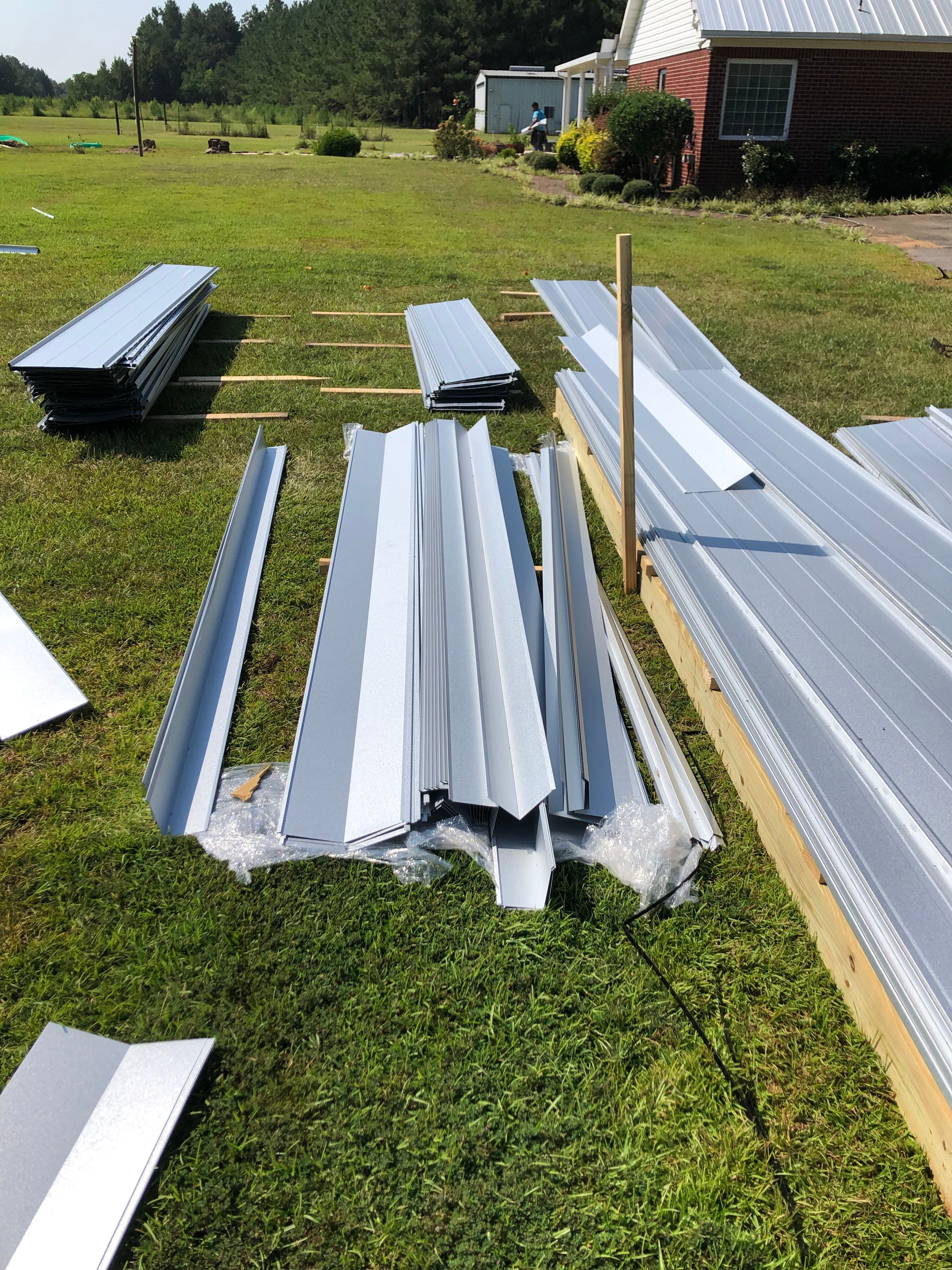 Residential Roofing Installation using Metal roofing by American Roofing & Construction LLC