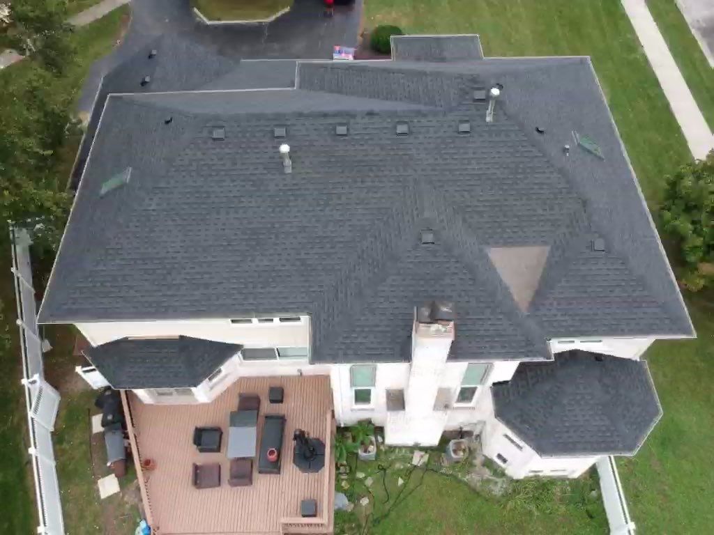 Roof and windows by Optimal Home Improvement 