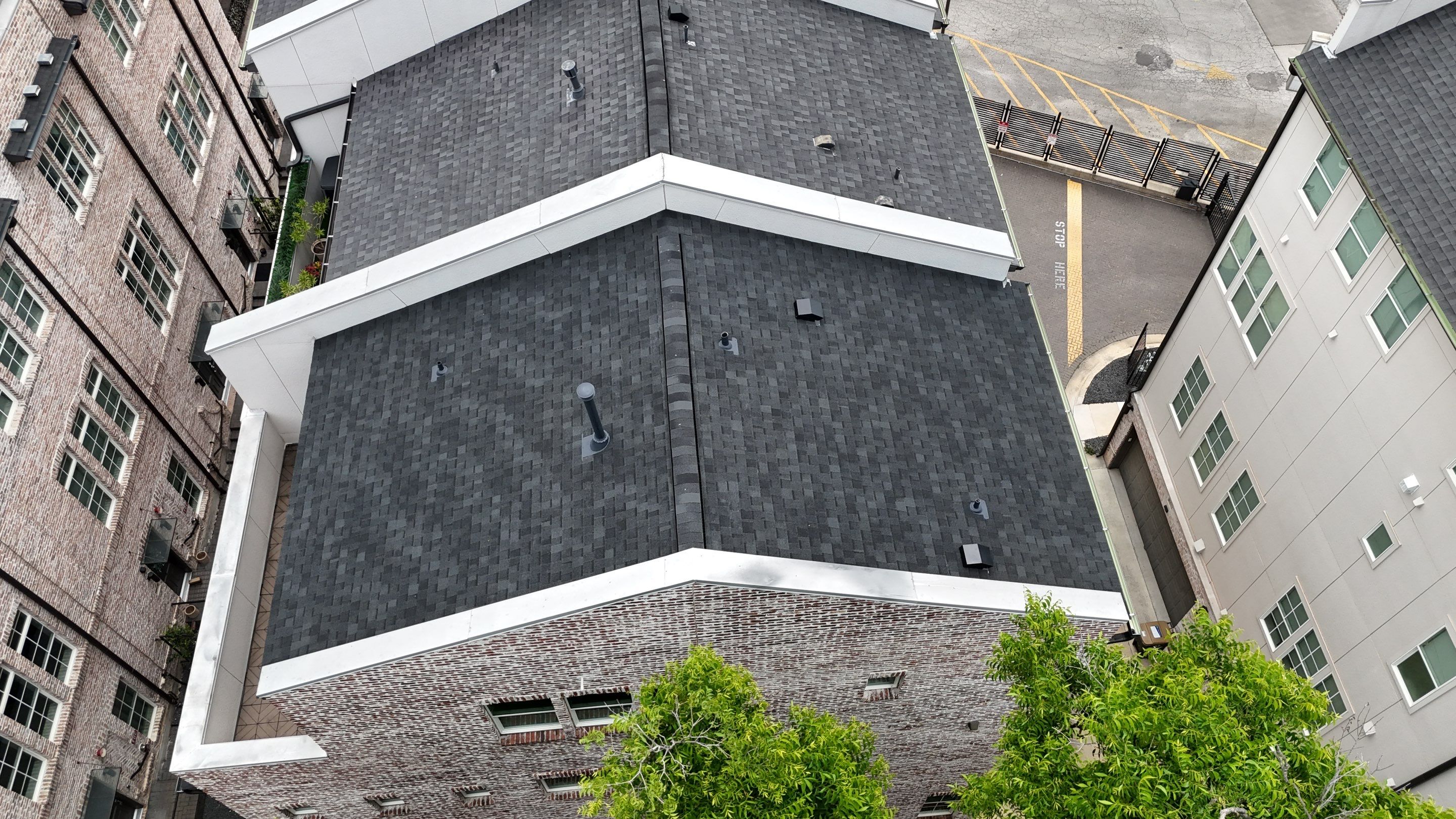 Residential Roof Replacement using TAMKO -  Stormfighter IR - Rustic Black by Action Exteriors Austin