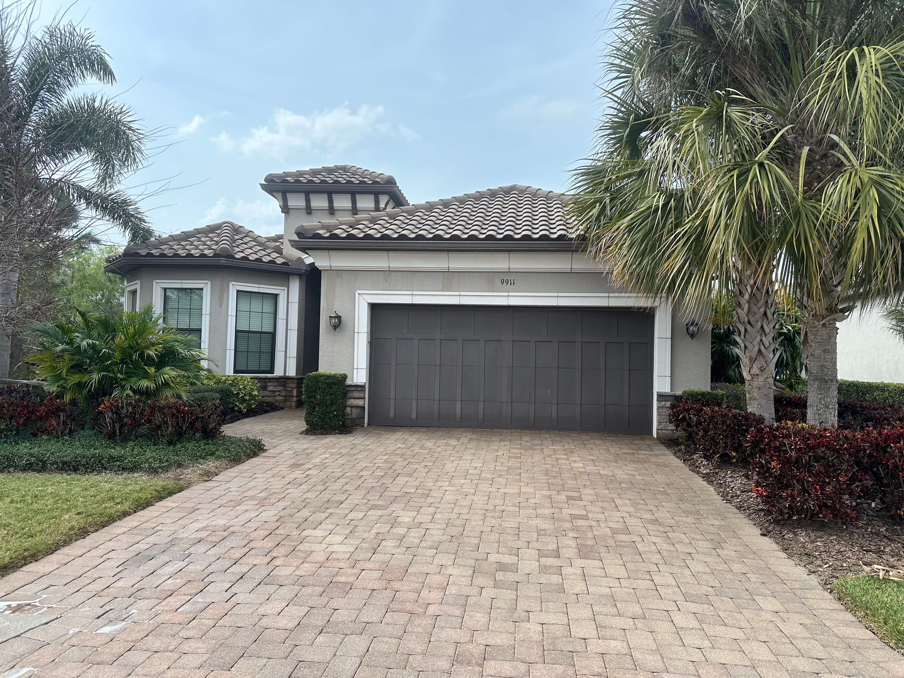 Concrete Tile Roof, Paver Pool Deck, Screen Enclosure & Driveway Cleaning in Artisan Lakes Esplanade, Palmetto, FL | Sunshine AquaWash by Sunshine AquaWash