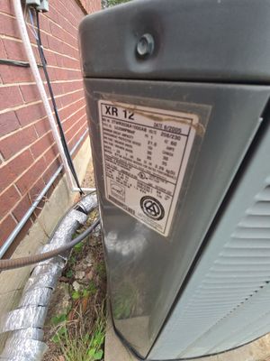 Close up of HVAC unit serial number plate