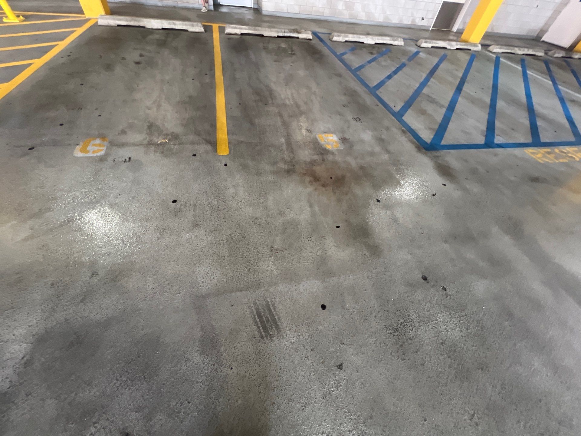 Parking garage using Hot water by Northern Power Washing LLC.