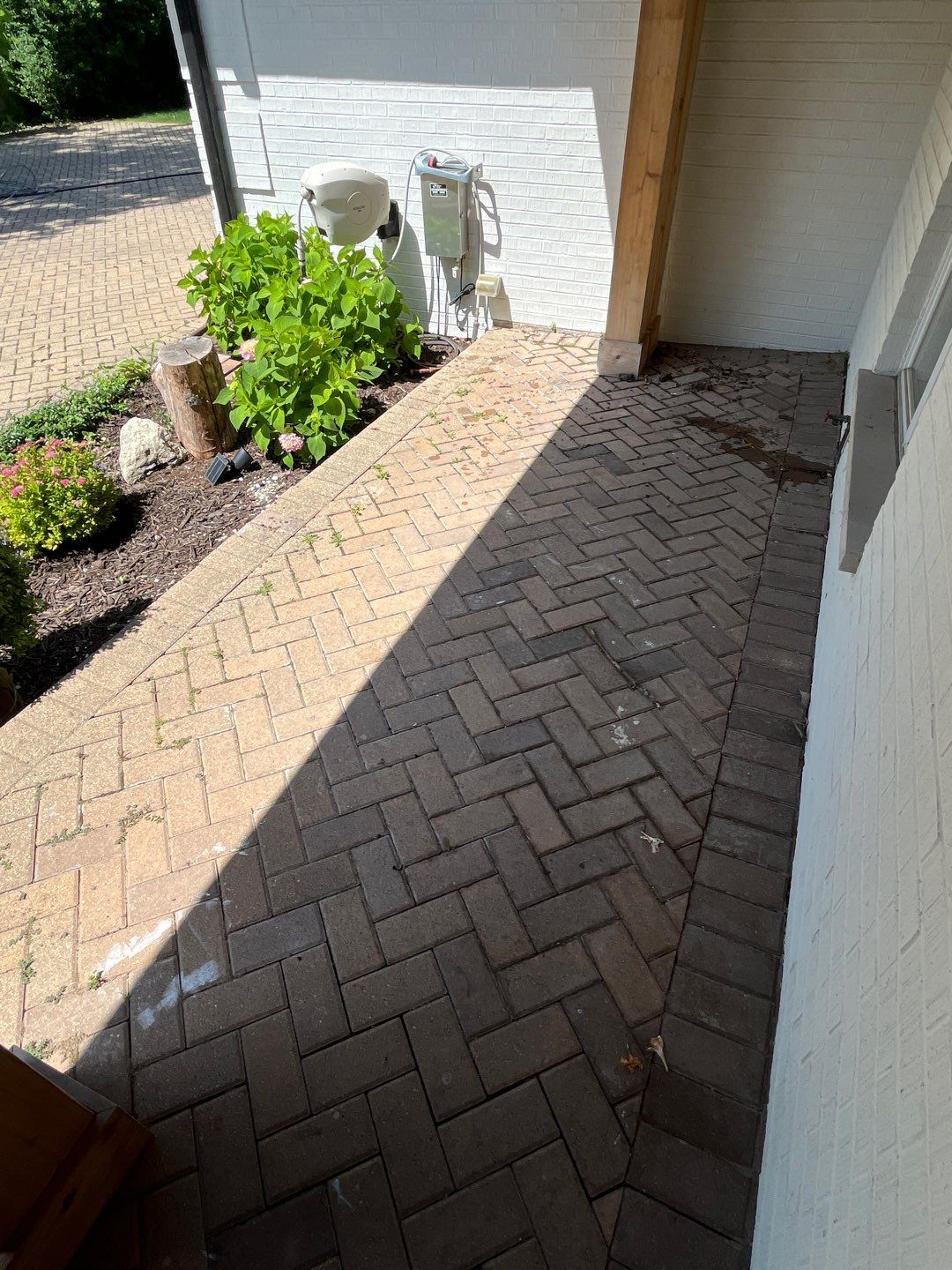 Brick paver repair, cleaning and sealing by Northern Power Washing LLC.