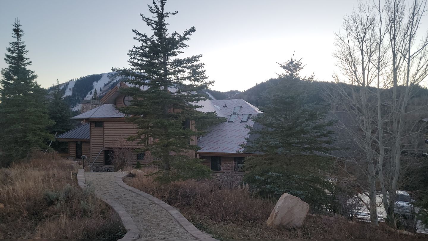 Standing Seam Metal Roof Replacement After Snow Damage by ASAP Roofing & Restoration