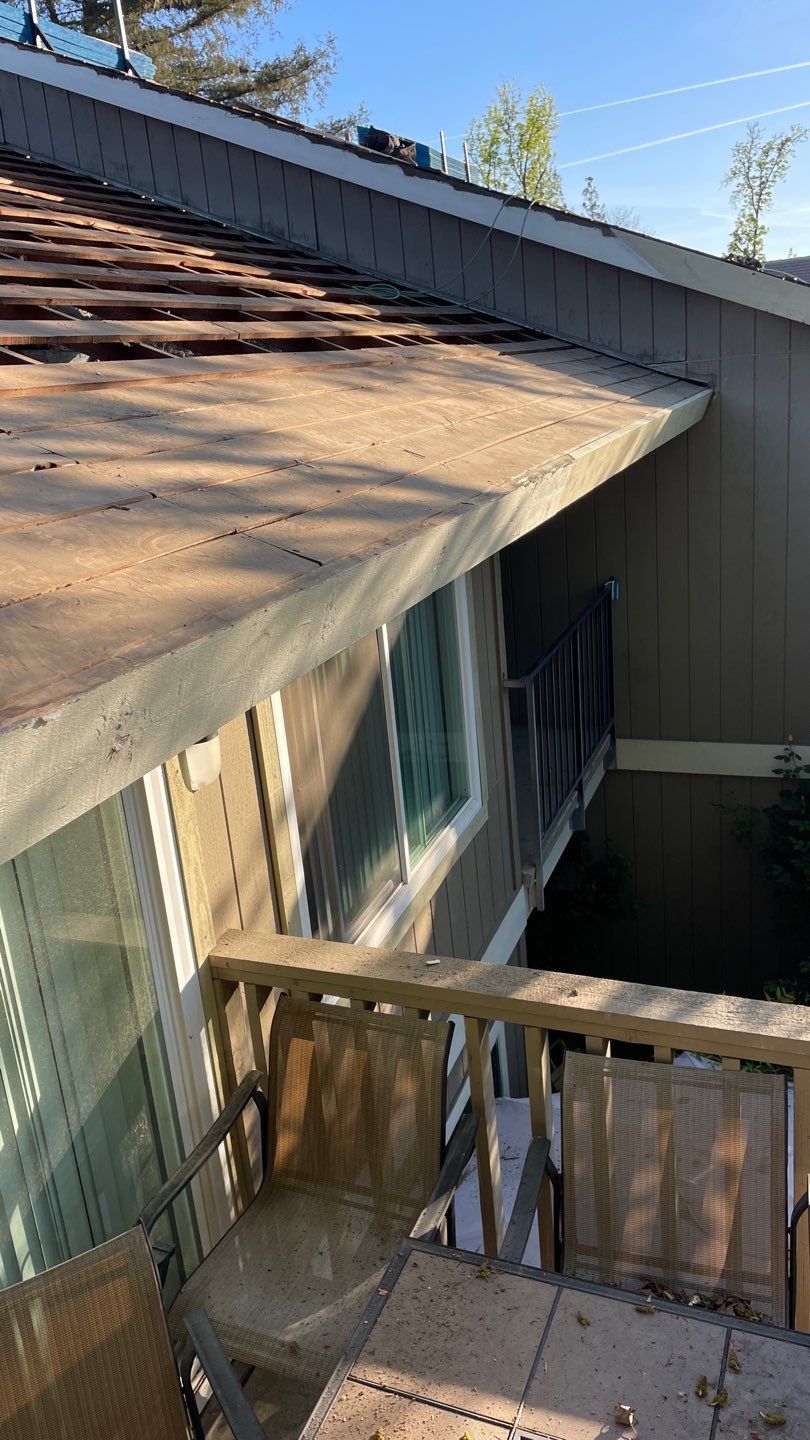 Removed tile from roof and replaced with shingles by Straight Edge Roofing Inc