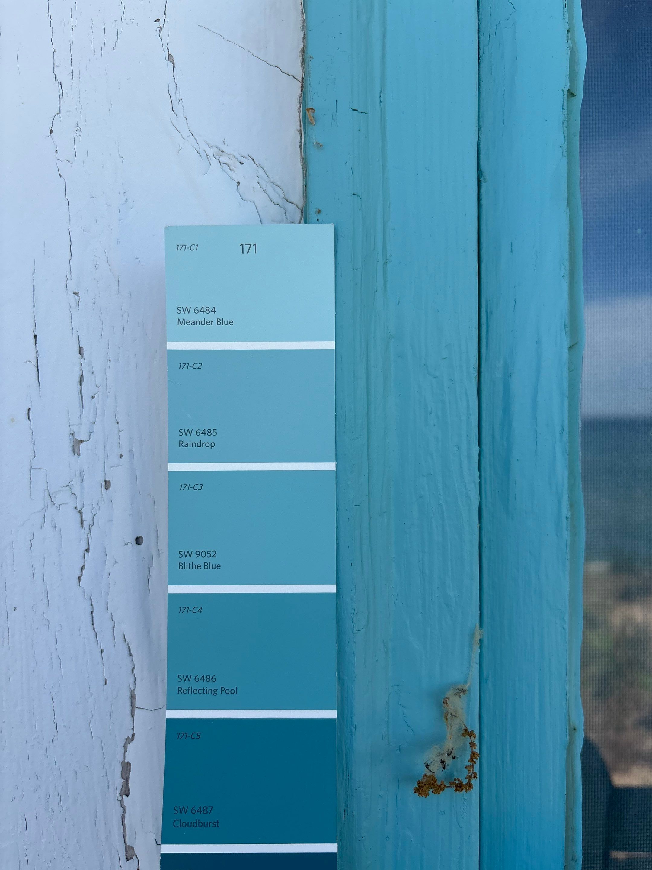 Lakeside Cottage Exterior Painting and Teal Trim Restoration in Mears by Gordon Painting