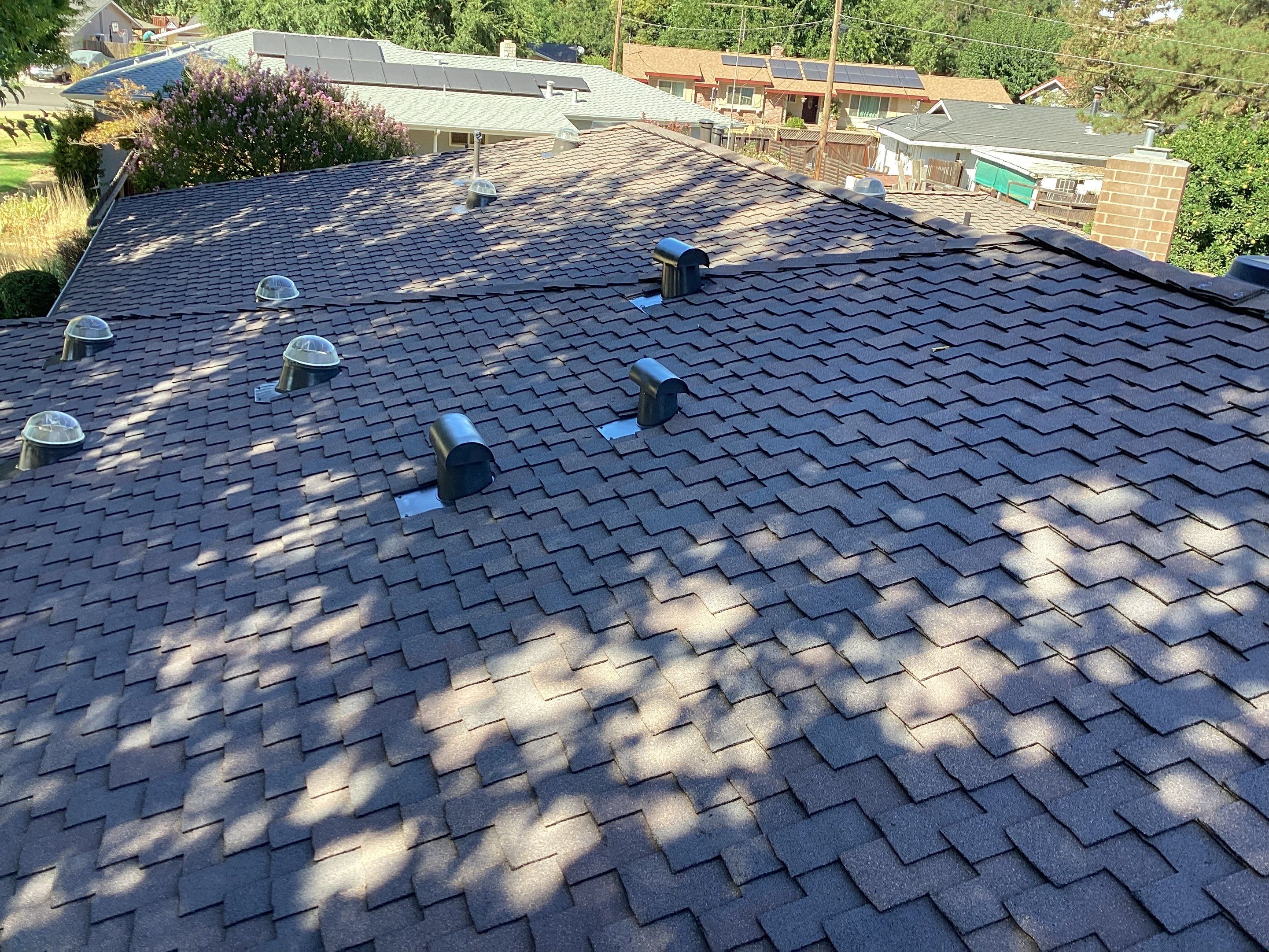 Installation of Certainteed Presidential shingles on residential house by Straight Edge Roofing Inc